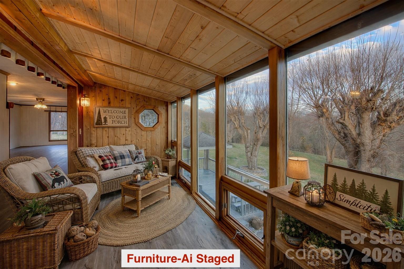 Sunroom with staged furniture - 220 Grand View Lane, Burnsville