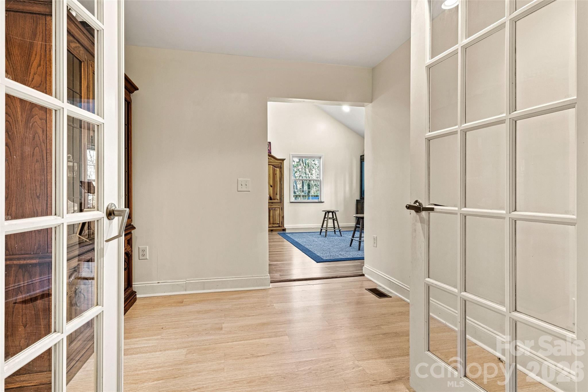 office area connecting/separating the primary bedroom and kitchen from the living room and second bedroom - 6051 Pointe West Lane, Vale