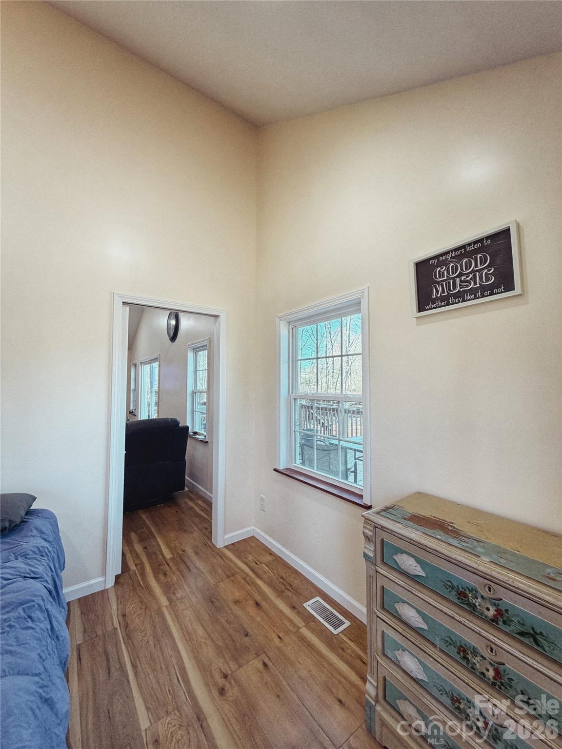 another view of new bedroom added downstairs - tons of natural light and high ceilings - 6051 Pointe West Lane, Vale