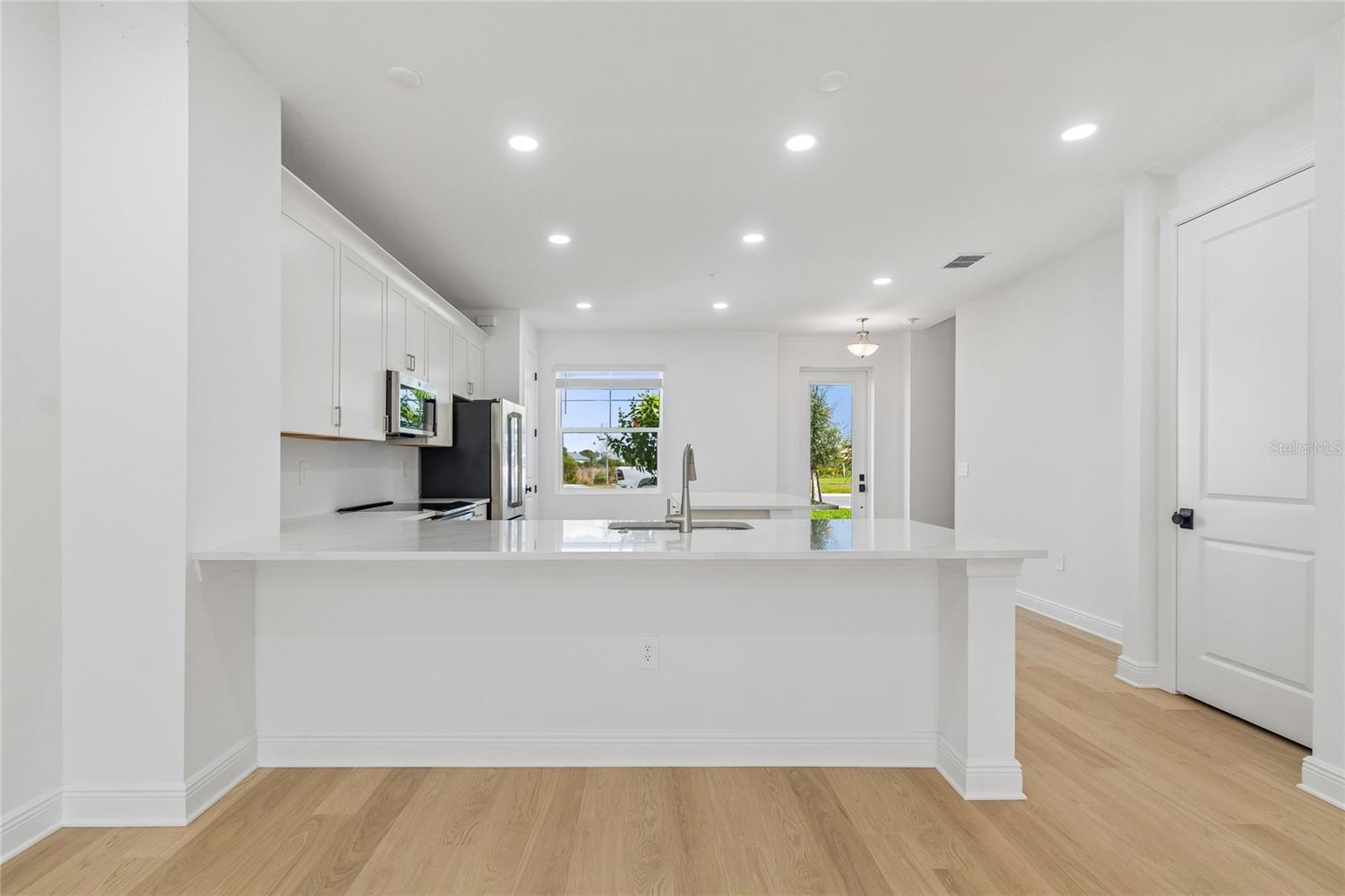 Kitchen-Photo description represents the model home of same floor plan. - 17736 BROADLEAF LOOP, VENICE