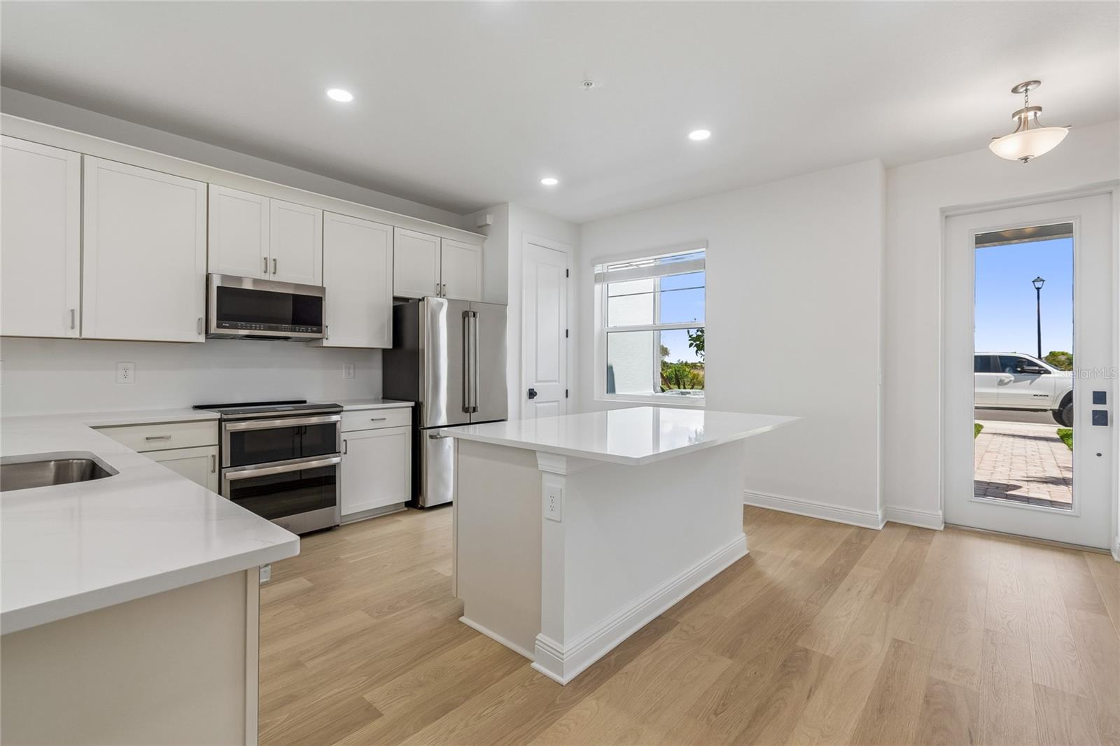 Kitchen-Photo description represents the model home of same floor plan. - 17736 BROADLEAF LOOP, VENICE