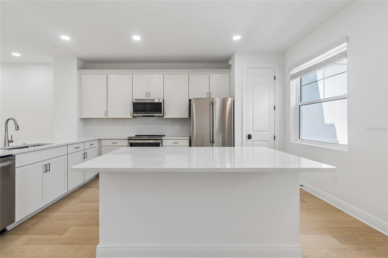 Kitchen-Photo description represents the model home of same floor plan. - 17736 BROADLEAF LOOP, VENICE
