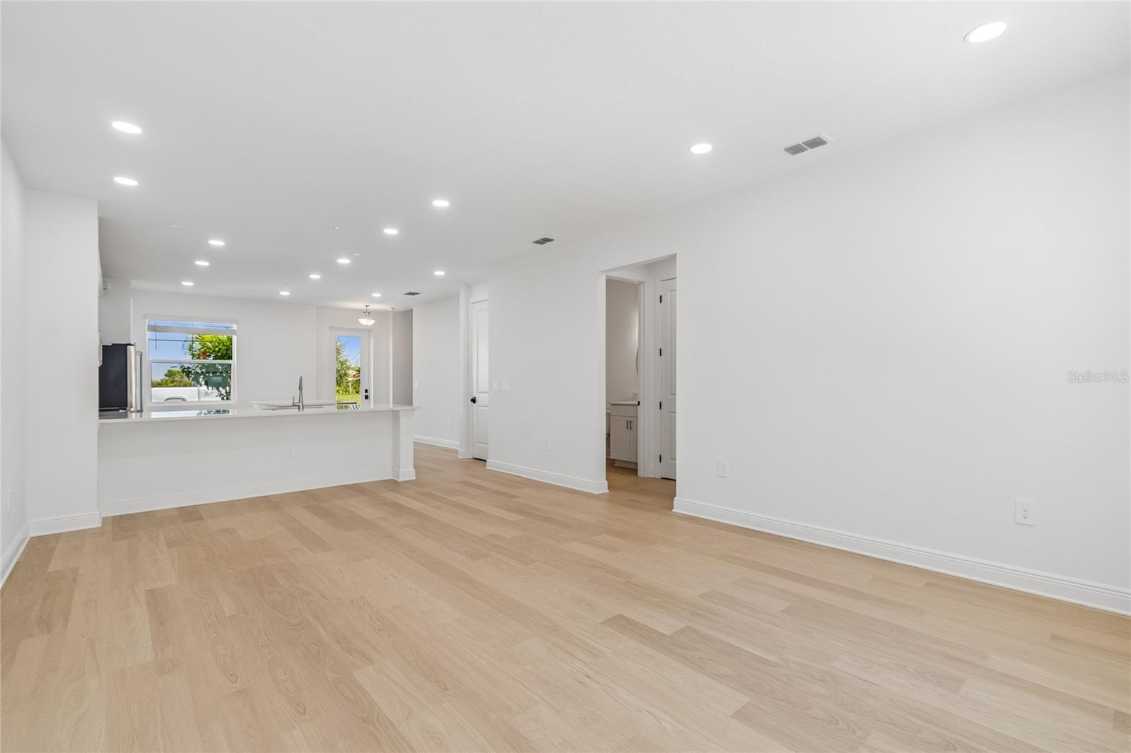 Great Room-Photo description represents the model home of same floor plan. - 17736 BROADLEAF LOOP, VENICE
