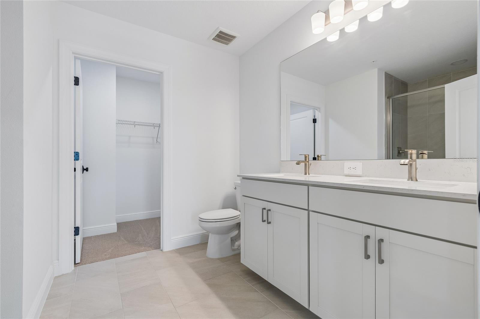 Primary Bath-Photo description represents the model home of same floor plan. - 17736 BROADLEAF LOOP, VENICE