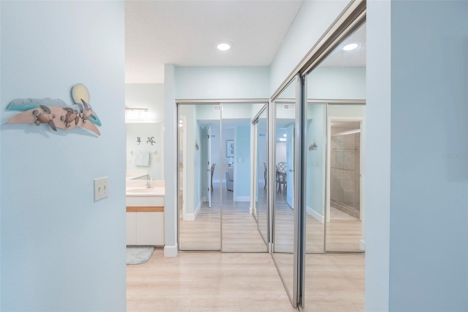 Entering into the primary ensuite bathroom, there is plenty of closet space. - 425 CERROMAR TER #459, VENICE