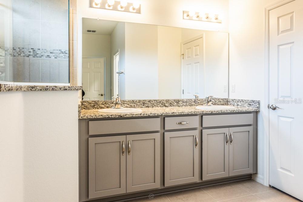 primary bathroom with spacious linen closet - 10 FISCHER LN, PALM COAST