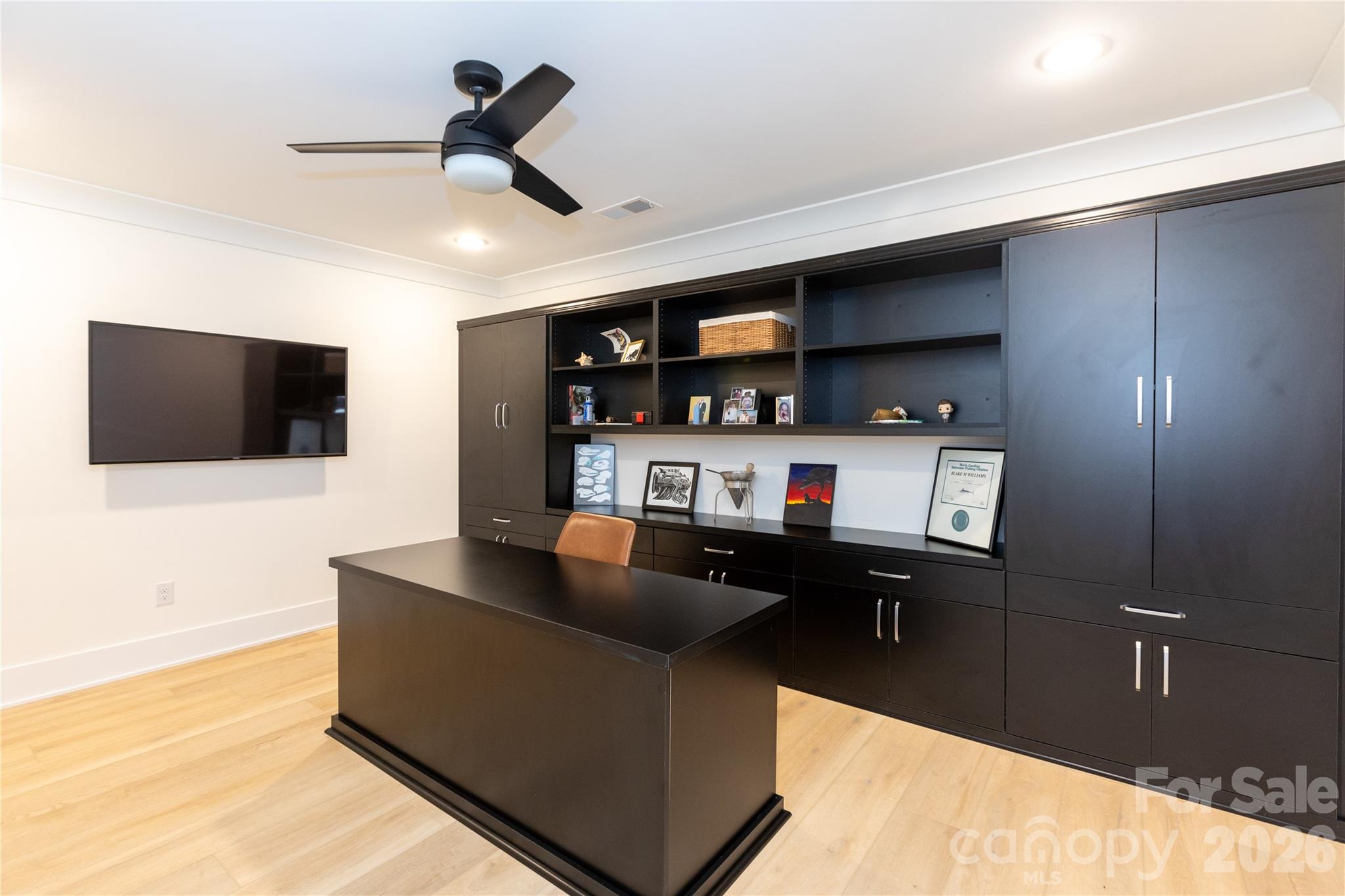 Office located in basement with built in storage and desk - 124 Direct Drive, Mooresville