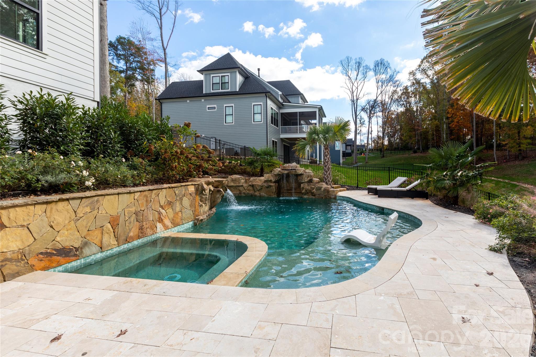 Saltwater pool with 2 waterfalls, tanning ledge & hot tub - 124 Direct Drive, Mooresville