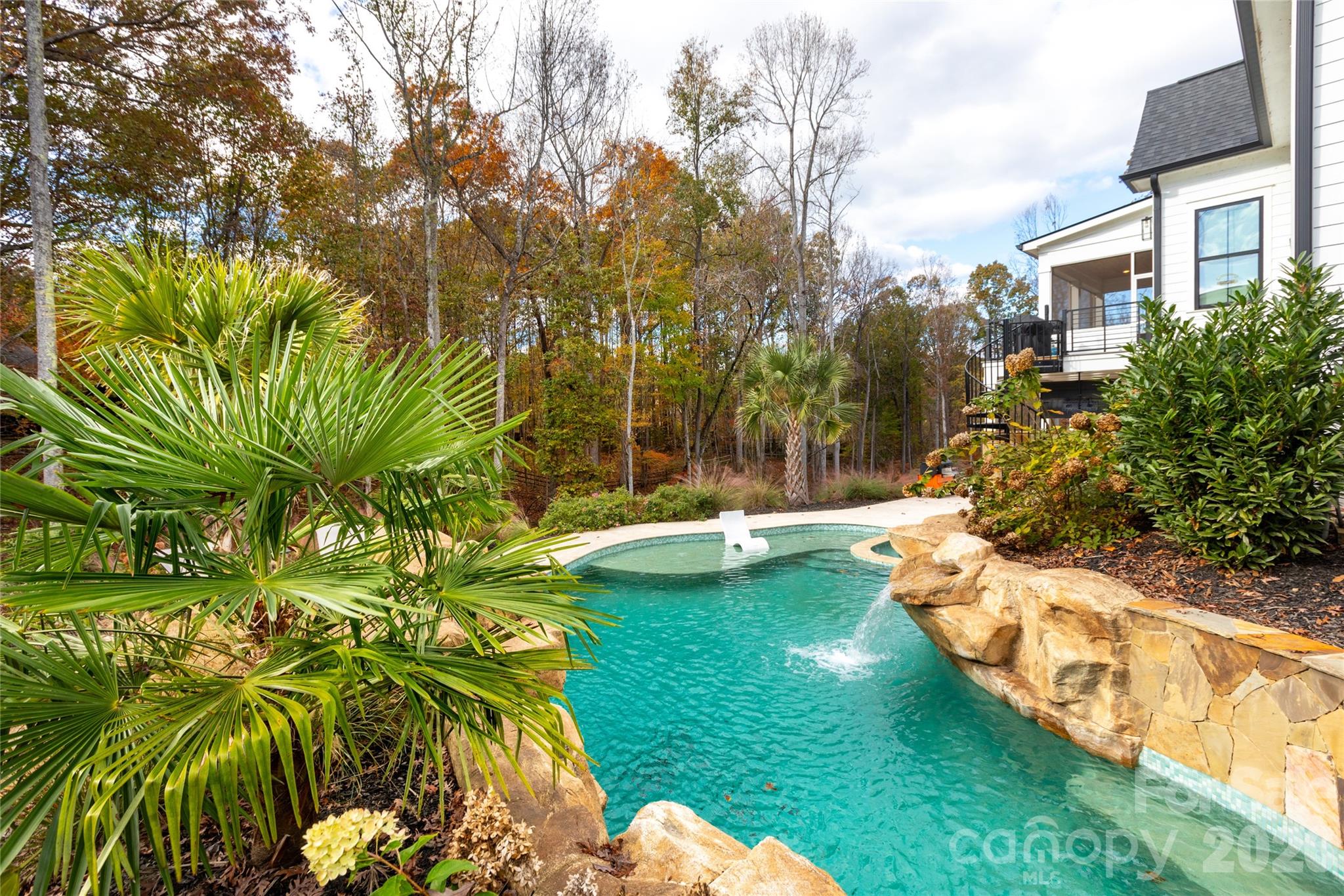 Saltwater pool with tanning ledge and seating bench - 124 Direct Drive, Mooresville