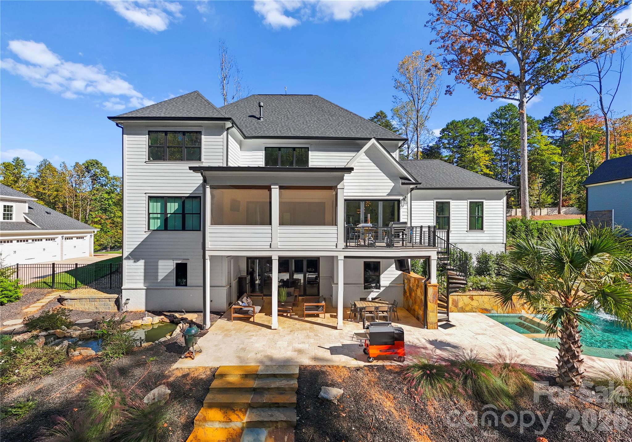 Beautiful travertine patio space and koi pond - 124 Direct Drive, Mooresville