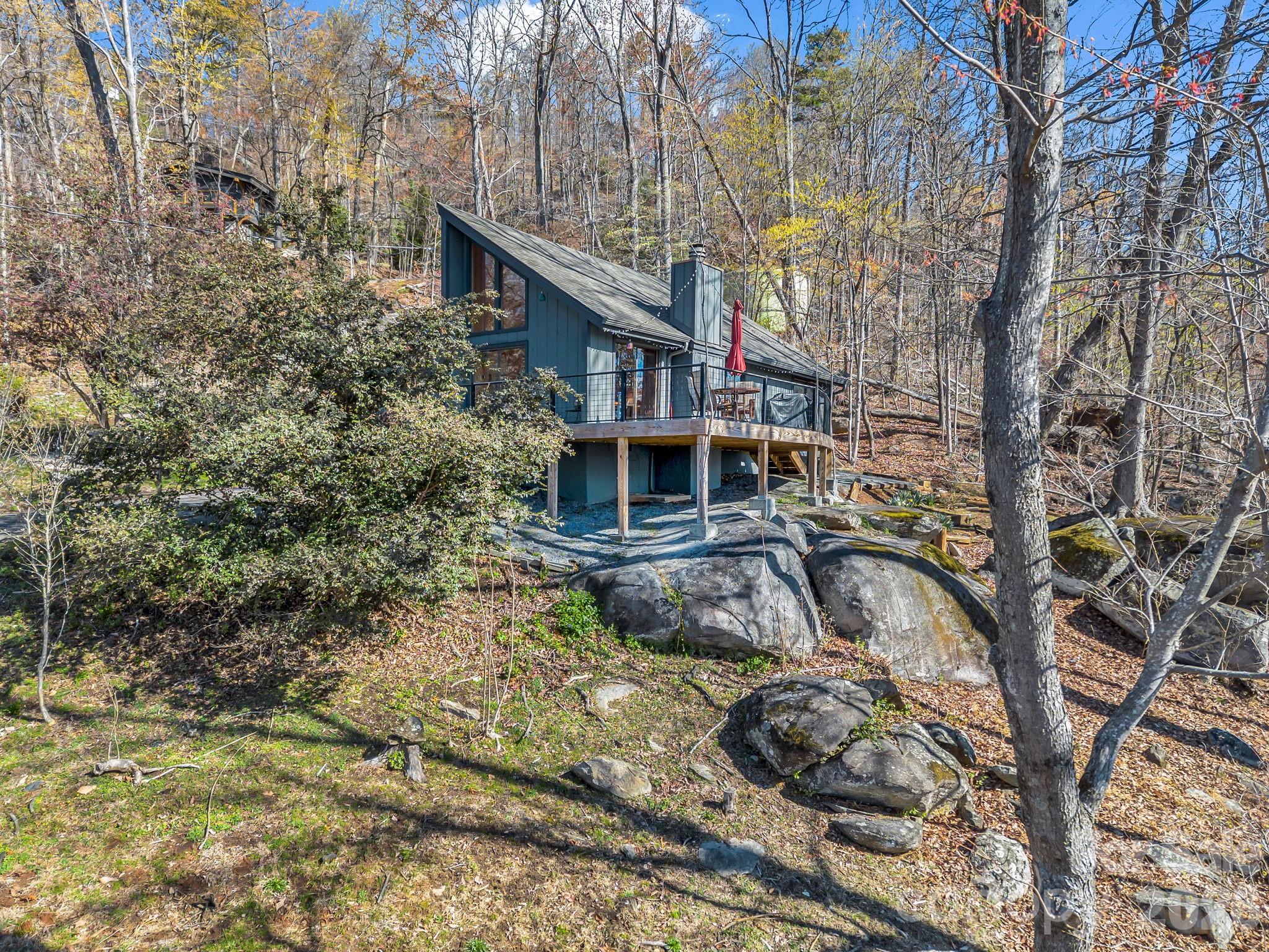 A rare property where the natural rock landscape becomes part of the design, giving an organic feel. - 456 Youngs Mountain Drive, Lake Lure