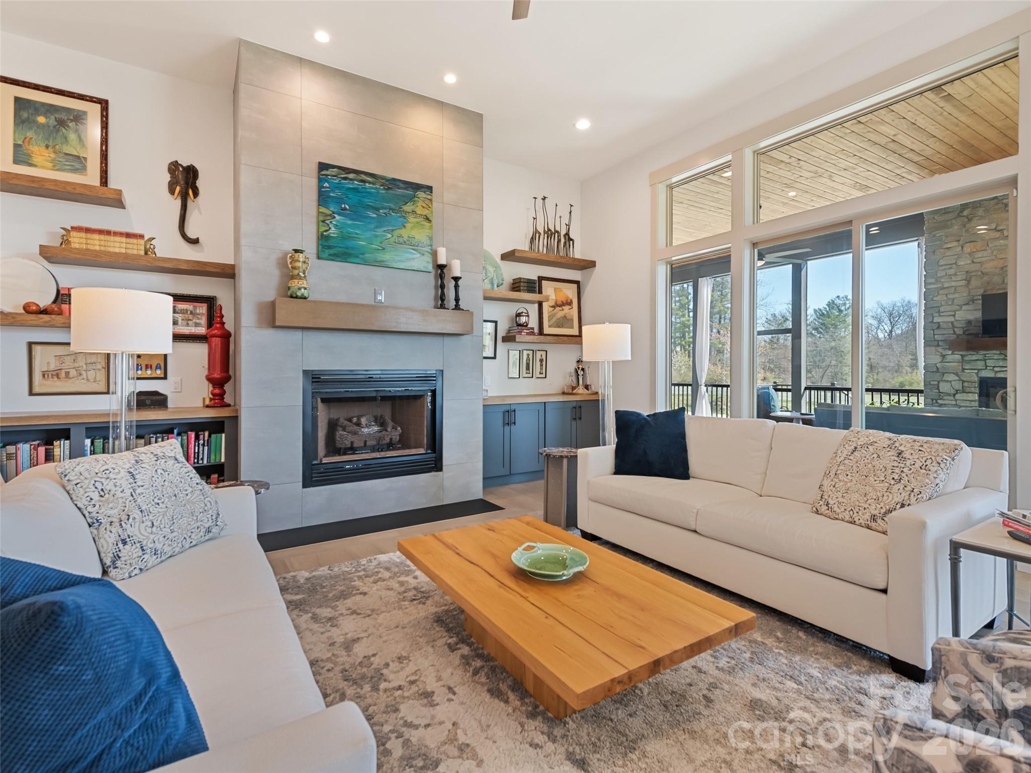 Living Room View 4, note rear windows viewing the expansive rear enclosed porch - 717 Daniel Circle Drive, Mills River