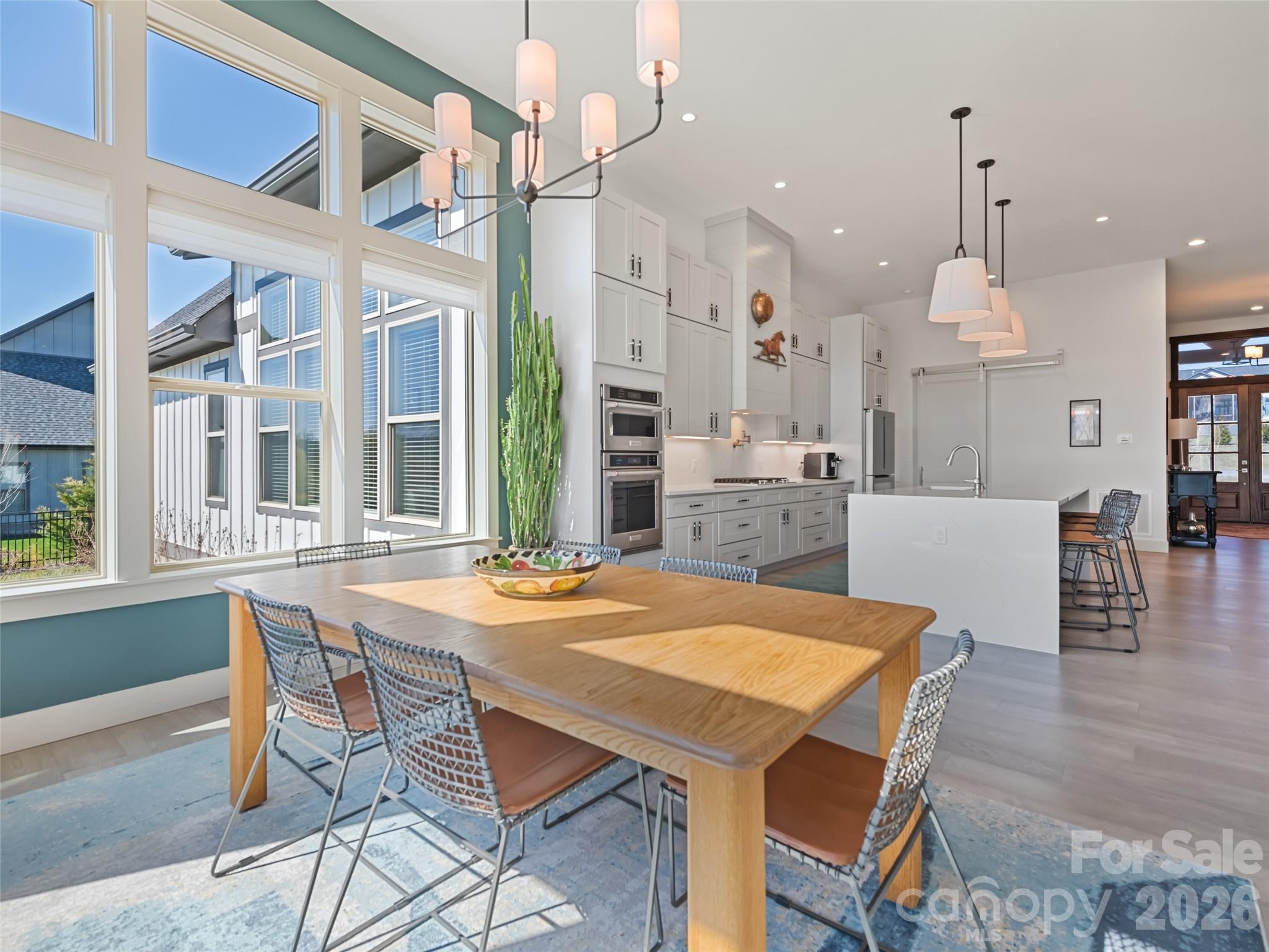 Another view of the spacious, naturally lit dining area beside kitchen - 717 Daniel Circle Drive, Mills River