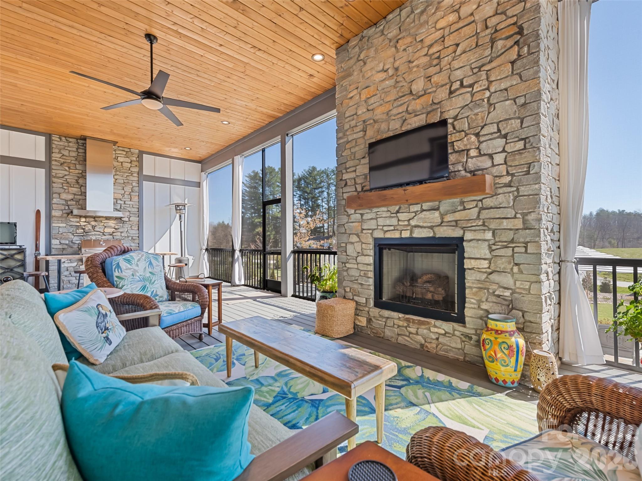 Beautiful fireplace centralizes the outdoor porch - 717 Daniel Circle Drive, Mills River