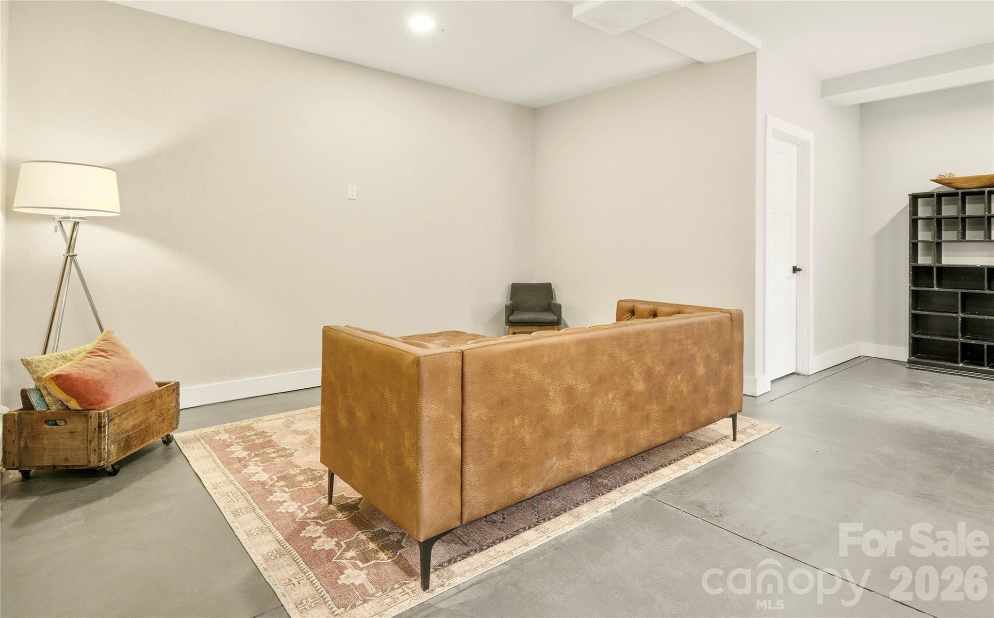 Downstairs living quarters with interior and exterior entrance, kitchen, den, 2 BR .1 spare room, 1 BA, storage concrete patioThe Perfect Upgrade: 5 Bedrooms of Comfort in an Exclusive Gated Community4374 Poplar Bluff Dr - The Coves Mountain River Club - 4374 Poplar Bluff Drive, Lenoir