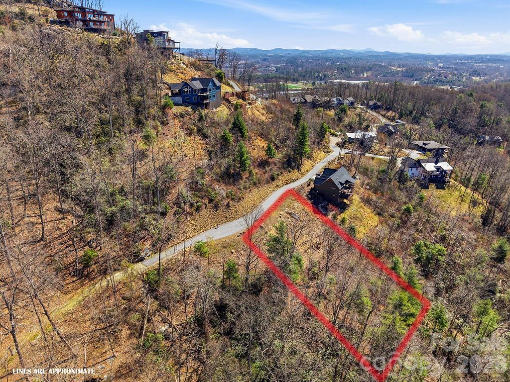Surrounded by luxury homes, this premier lot waits as your canvas to build your custom retreat in the sought-after Boulders Community. - 367 Curtain Bluff, Hendersonville