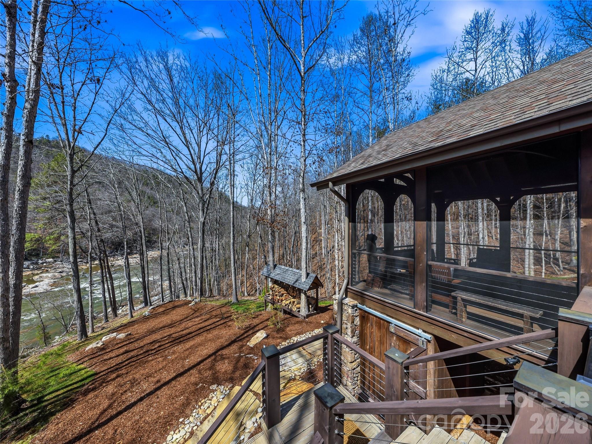 Lovely screened porch with outdoor shower below. Wood rack and perfect sitting/fire pit area. - 3735 French Broad Parkway, Marshall
