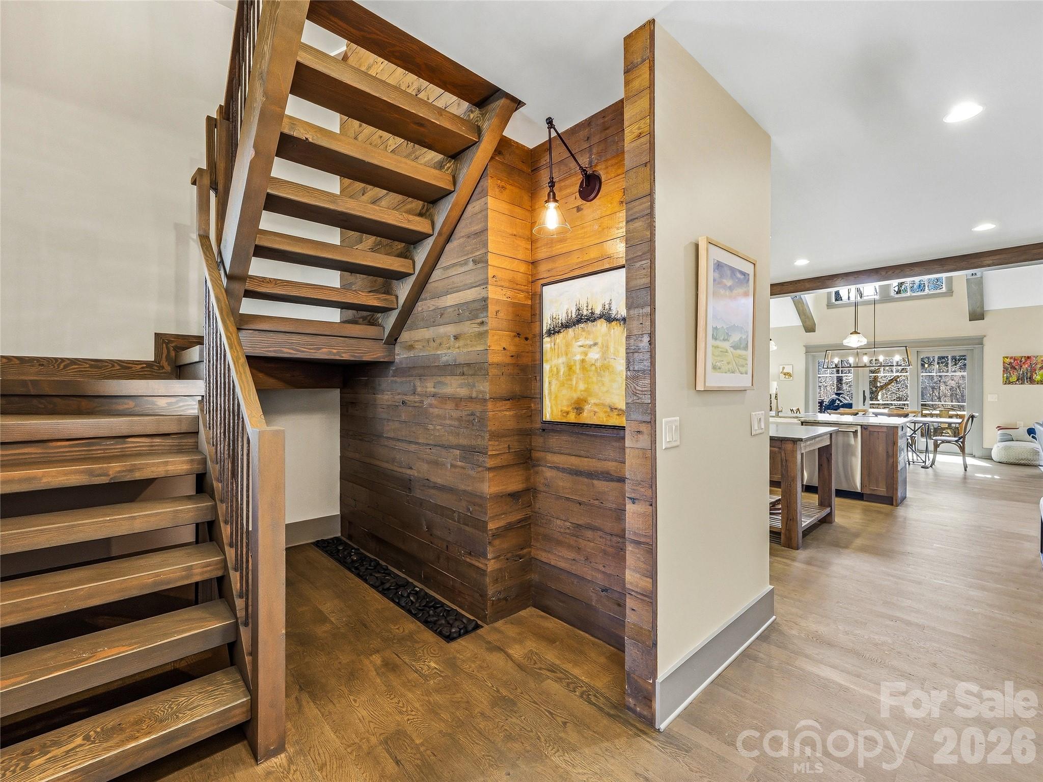 Welcoming foyer with art niche and stairs to the upper level bedroom/bonus room, full bath, and walk-in storage. - 3735 French Broad Parkway, Marshall