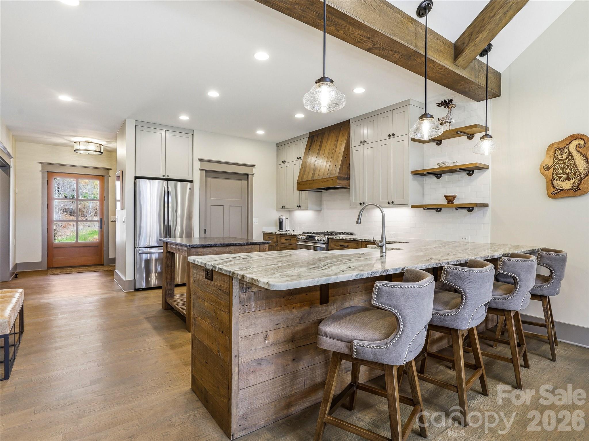 Chef's delight kitchen with breakfast bar and view of foyer. - 3735 French Broad Parkway, Marshall