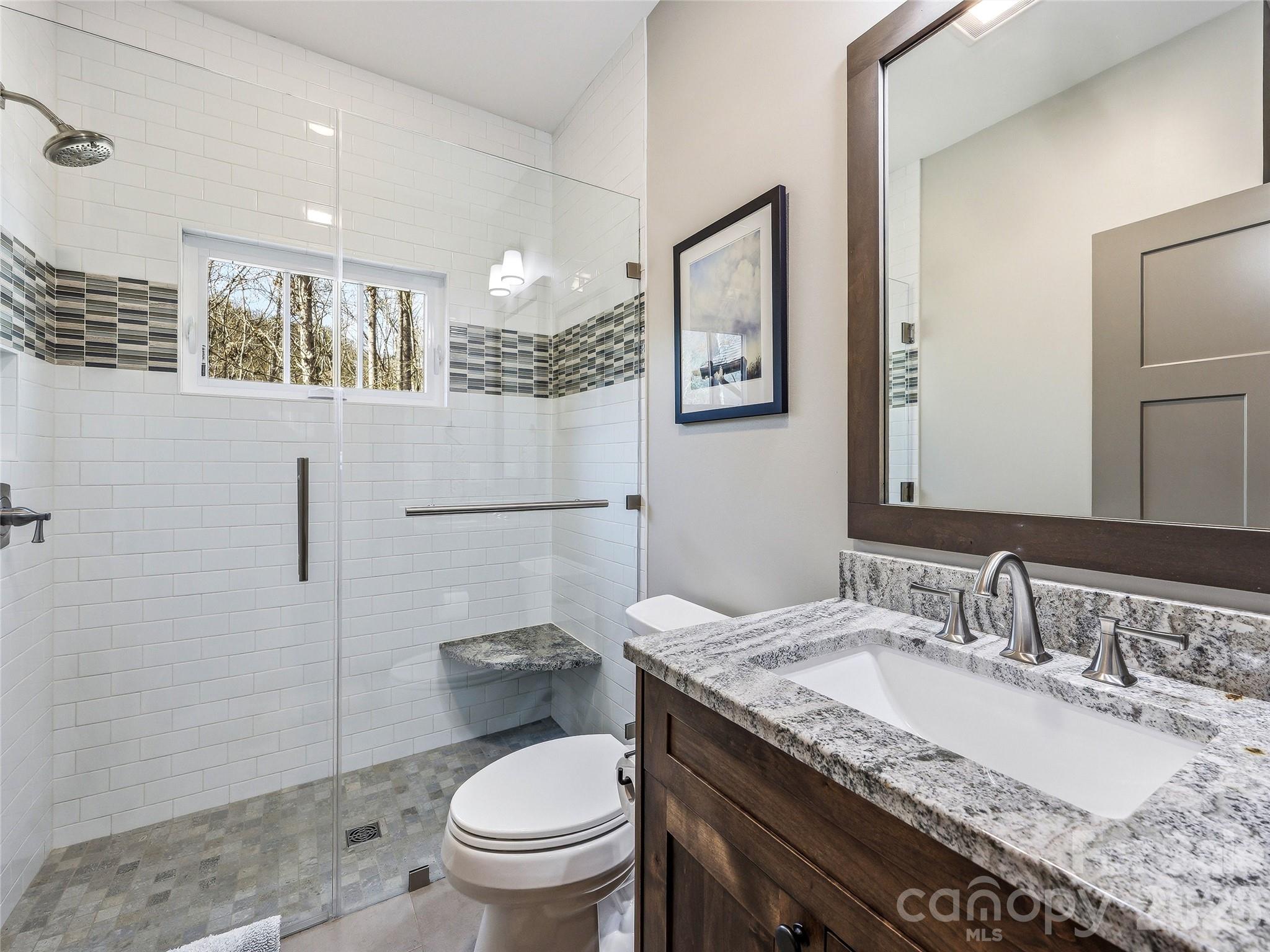 Hall bath with large walk-in shower between bedrooms 2 and 3. - 3735 French Broad Parkway, Marshall