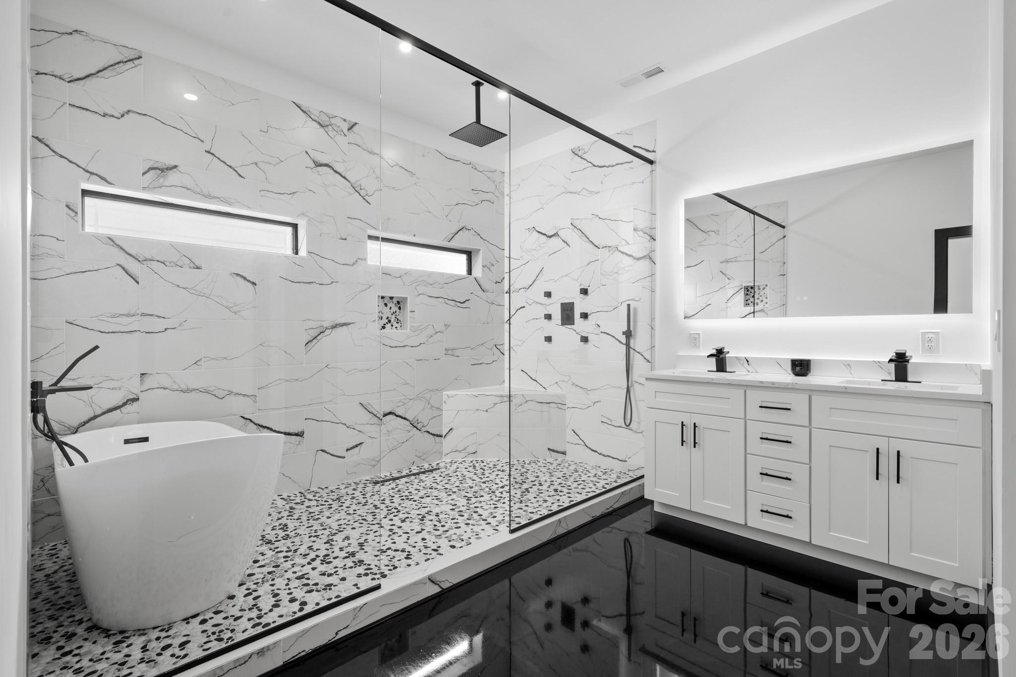 En suite bathroom with walk in closet and laundry hookup - 74 Jeranna Road, Mills River