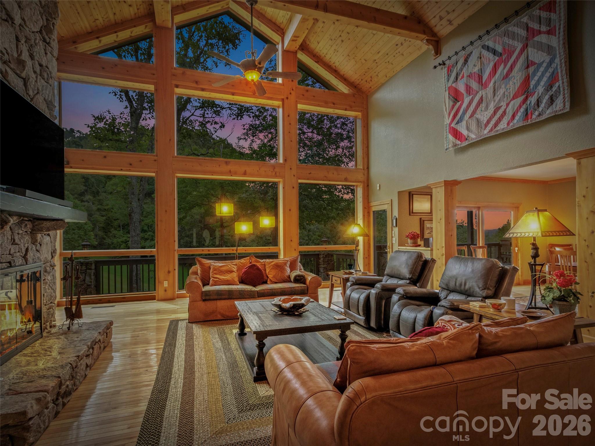 Twilight view through stunning wall of windows - 151 Austin Mountain Drive, Burnsville