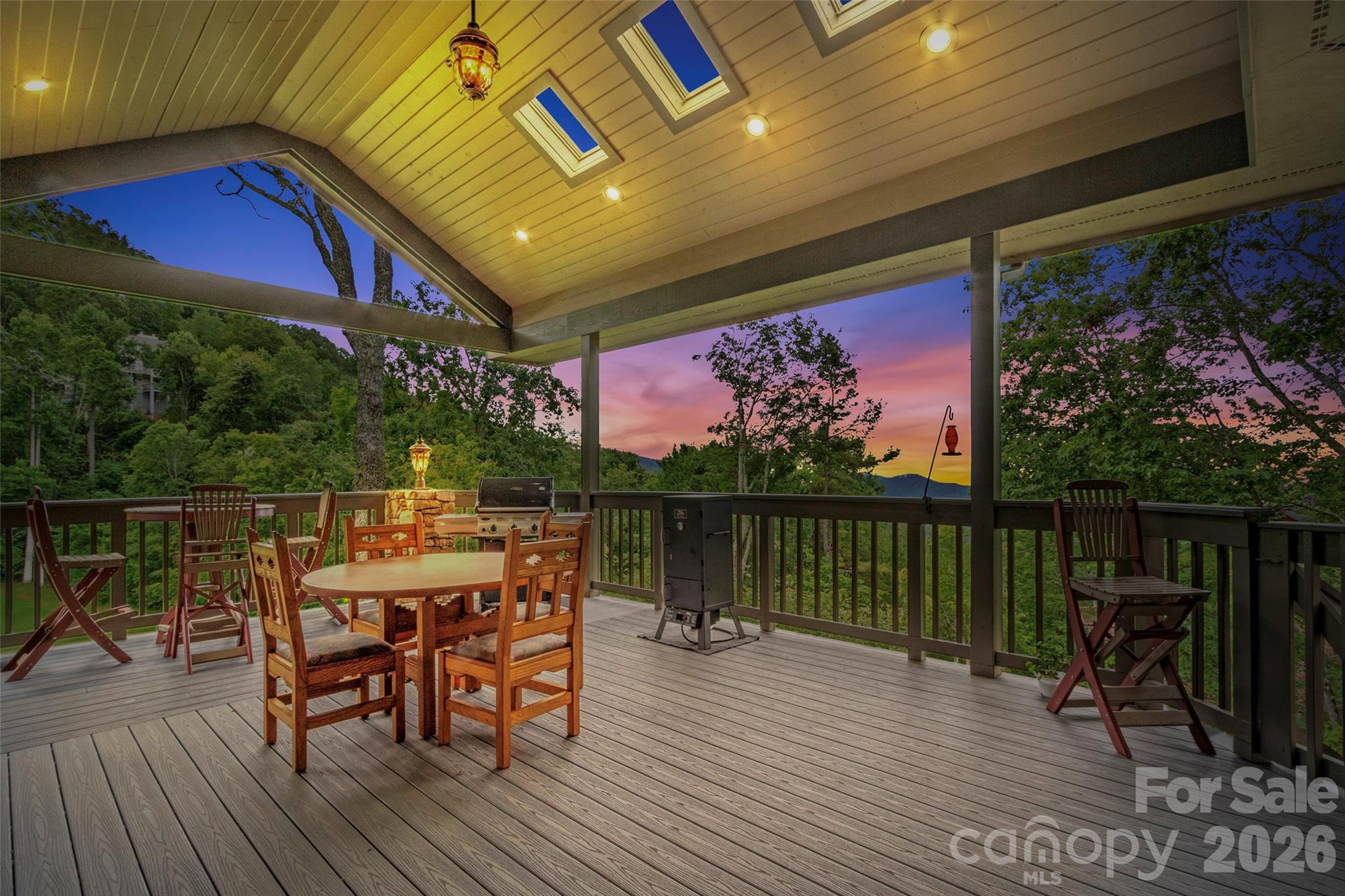 Spacious covered outdoor dining area with stunning sunset views - 151 Austin Mountain Drive, Burnsville