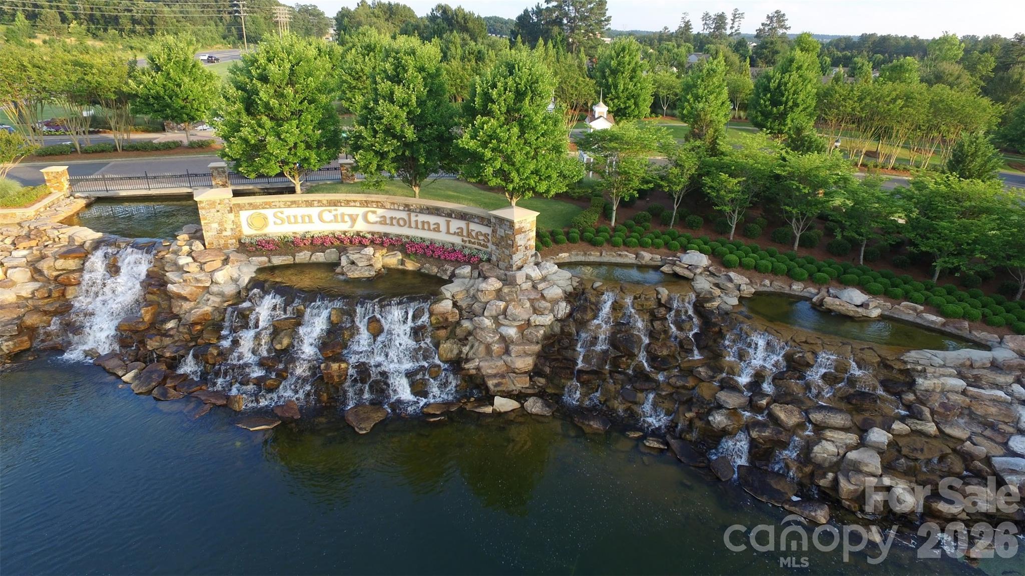 The majestic entrance to Sun City Carolina Lakes welcomes residents and guests to this premier active adult community. Come live the dream! - 49015 Gladiolus Street, Indian Land
