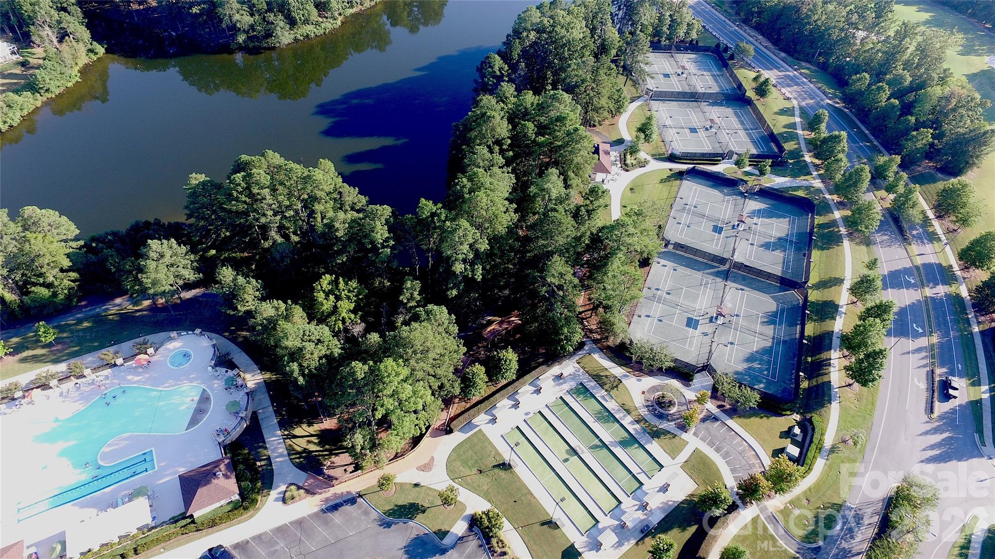 Bocce and tennis courts can be seen as you drive along Del Webb Boulevard. Pickleball courts can be found on the other side of The Lake House, as well as at The Lodge, and Water's Edge Park. - 49015 Gladiolus Street, Indian Land