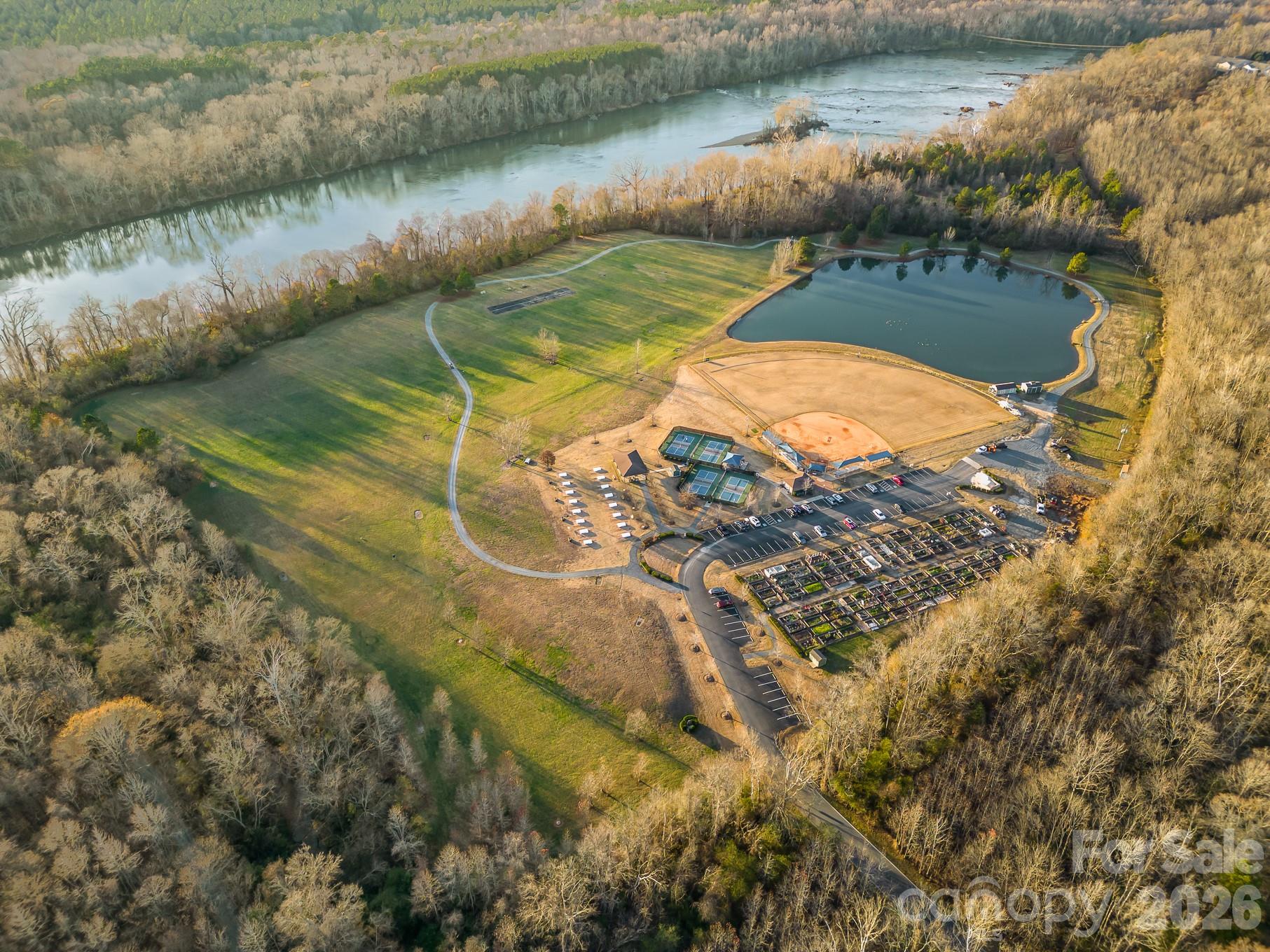 Water's Edge Park, located near the Catawba River, is home to pickleball, horseshoes, softball, fishing, frisbee golf, and a model airplane airstrip. It is also home to one of two community gardens. A walk on the path around the area can provide a glimpse of some of the wonderful wildlife that inhabit the area. - 49015 Gladiolus Street, Indian Land