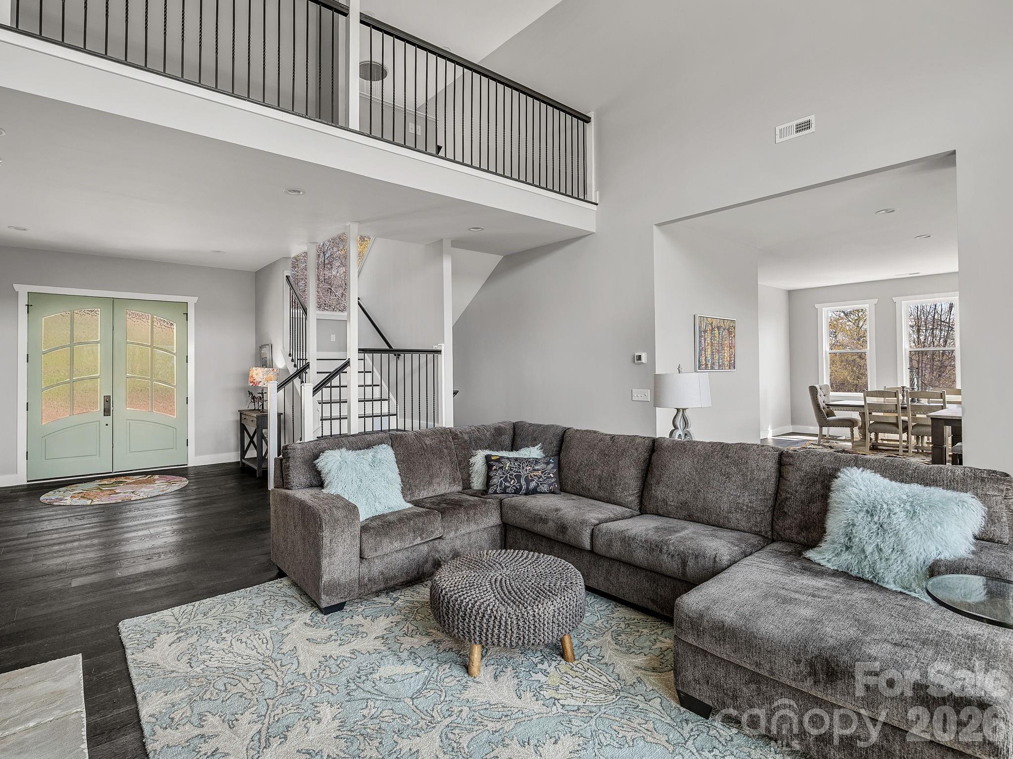 Open plan with stairway to upper floor primary suite. - 345 Preservation Trail, Columbus