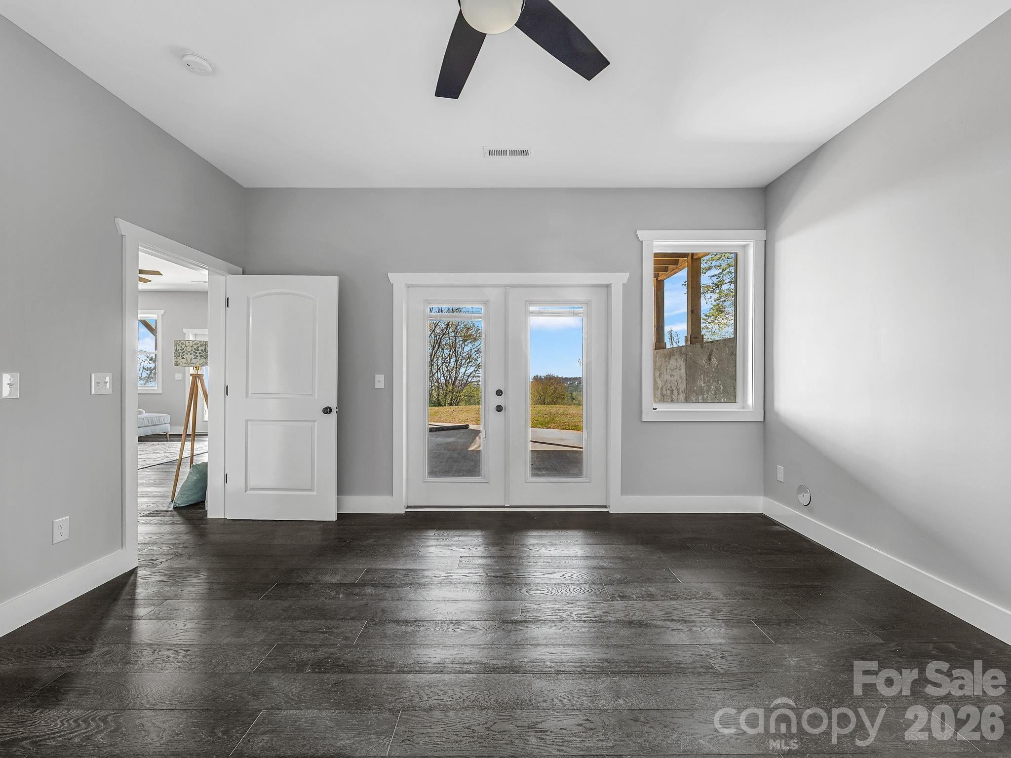 Lower level bedroom ensuite #1 with bath and outside exit to patio. - 345 Preservation Trail, Columbus