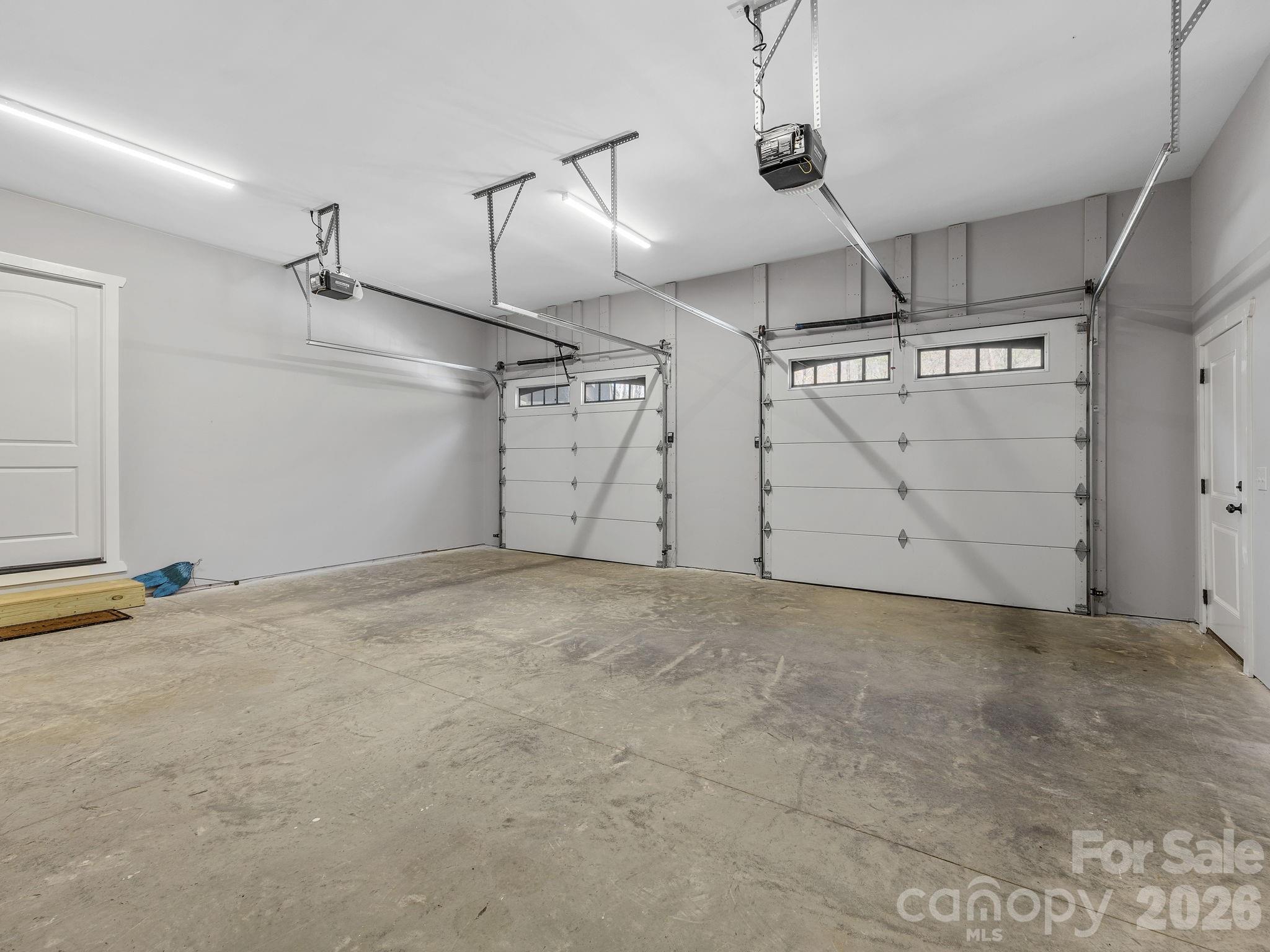 Two car garage with exit door and entry door to main level. - 345 Preservation Trail, Columbus