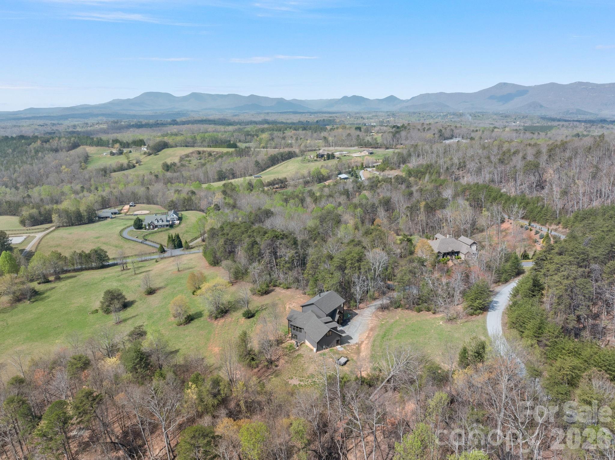 Aerial view house and surrounding countryside framed by Blue Ridge Mountains. - 345 Preservation Trail, Columbus