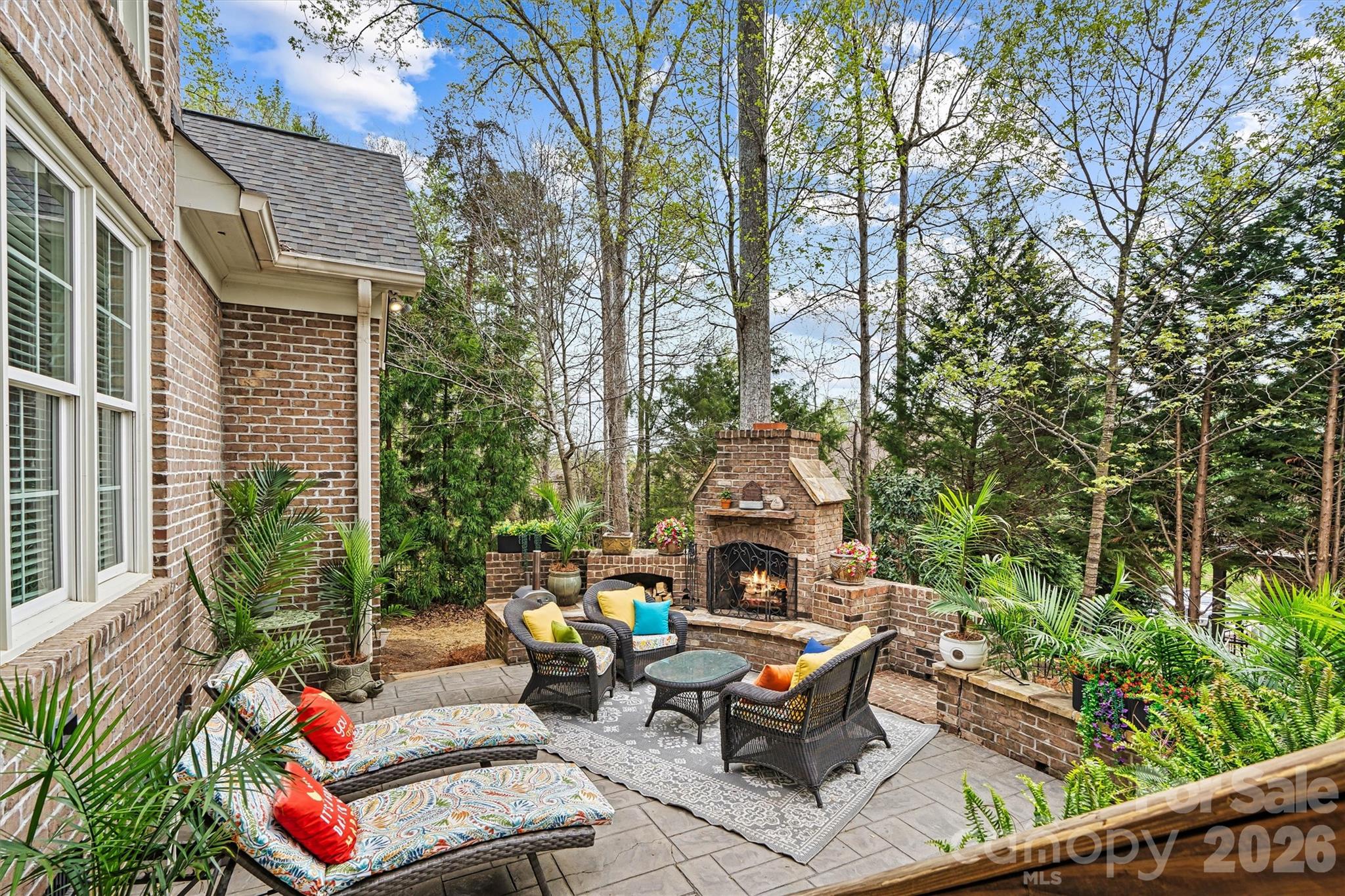 Patio with fireplace for year-round outdoor living - 224 Birdie Drive, Stanley