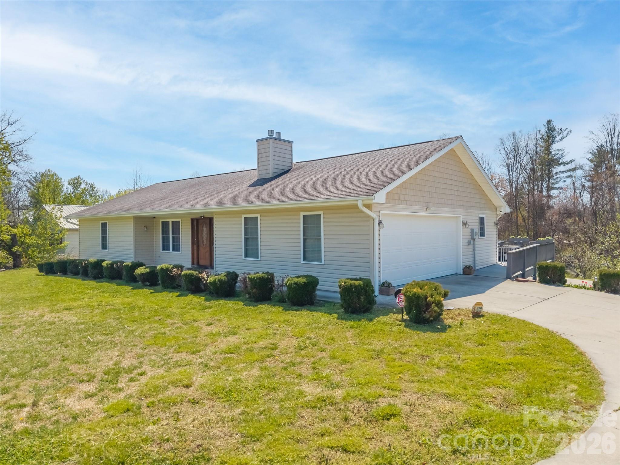 Side with garage and driveway - 476 Jackson Loop Road, Flat Rock