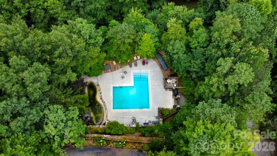 bird’s-eye view of pool area in the summer - 121 Toxaway Views Drive, Lake Toxaway