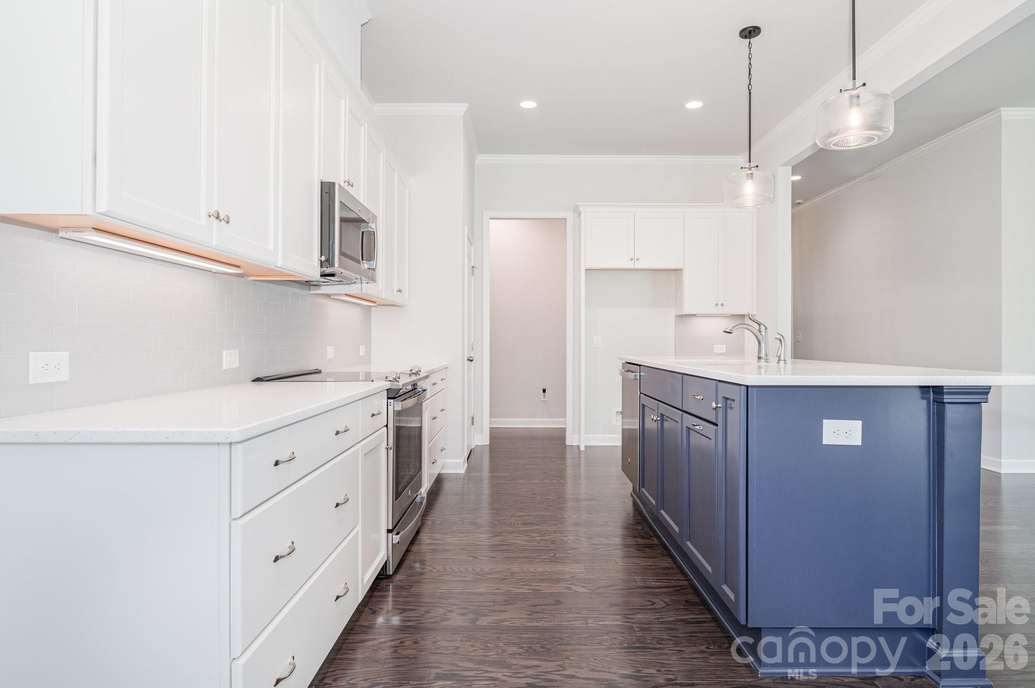 "Chef's" kitchen with an amazing island with pendant lights. - 456 Lucky Drive NW, Concord
