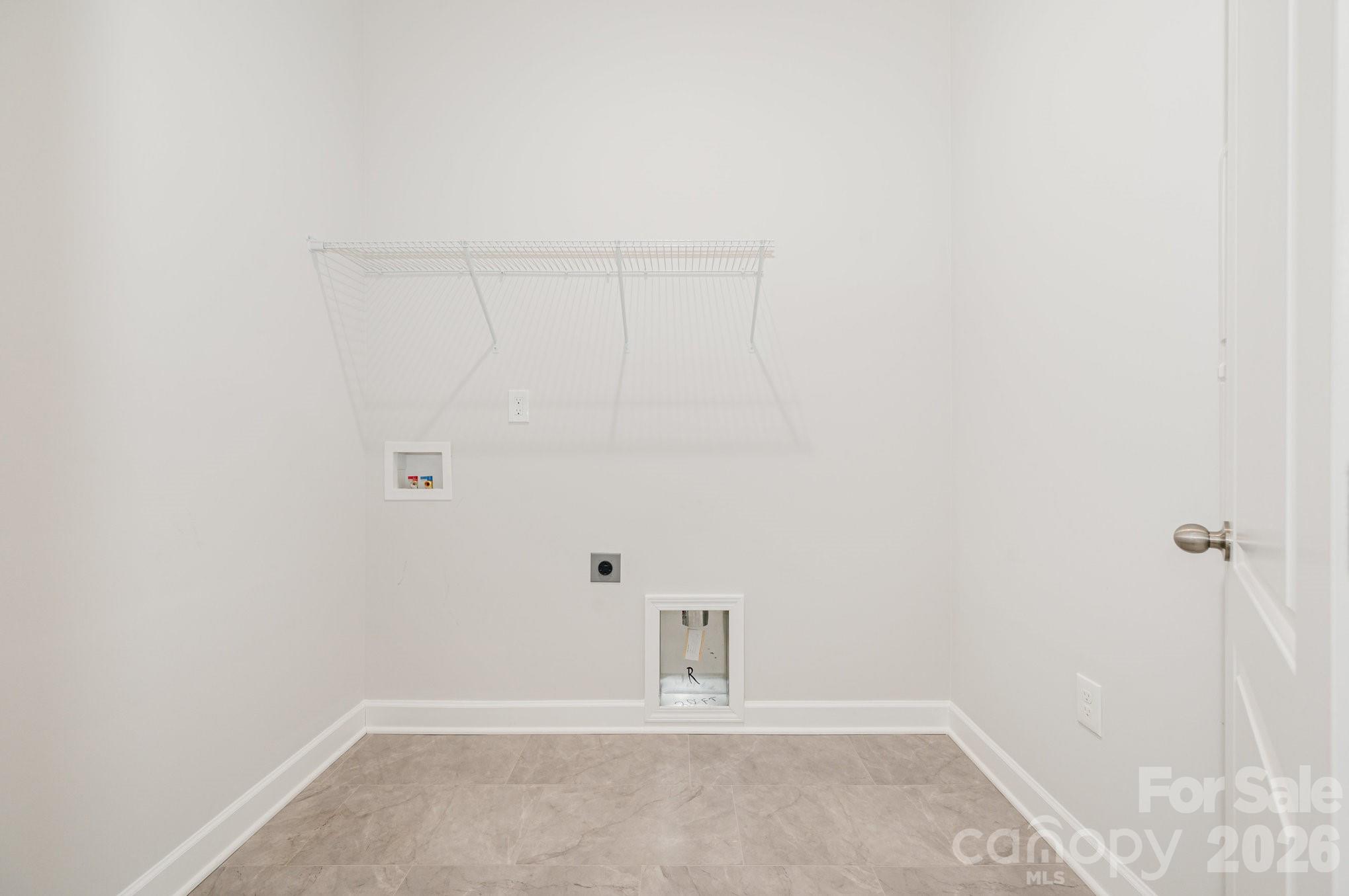 Laundry room right off the 3-car garage entry. - 456 Lucky Drive NW, Concord