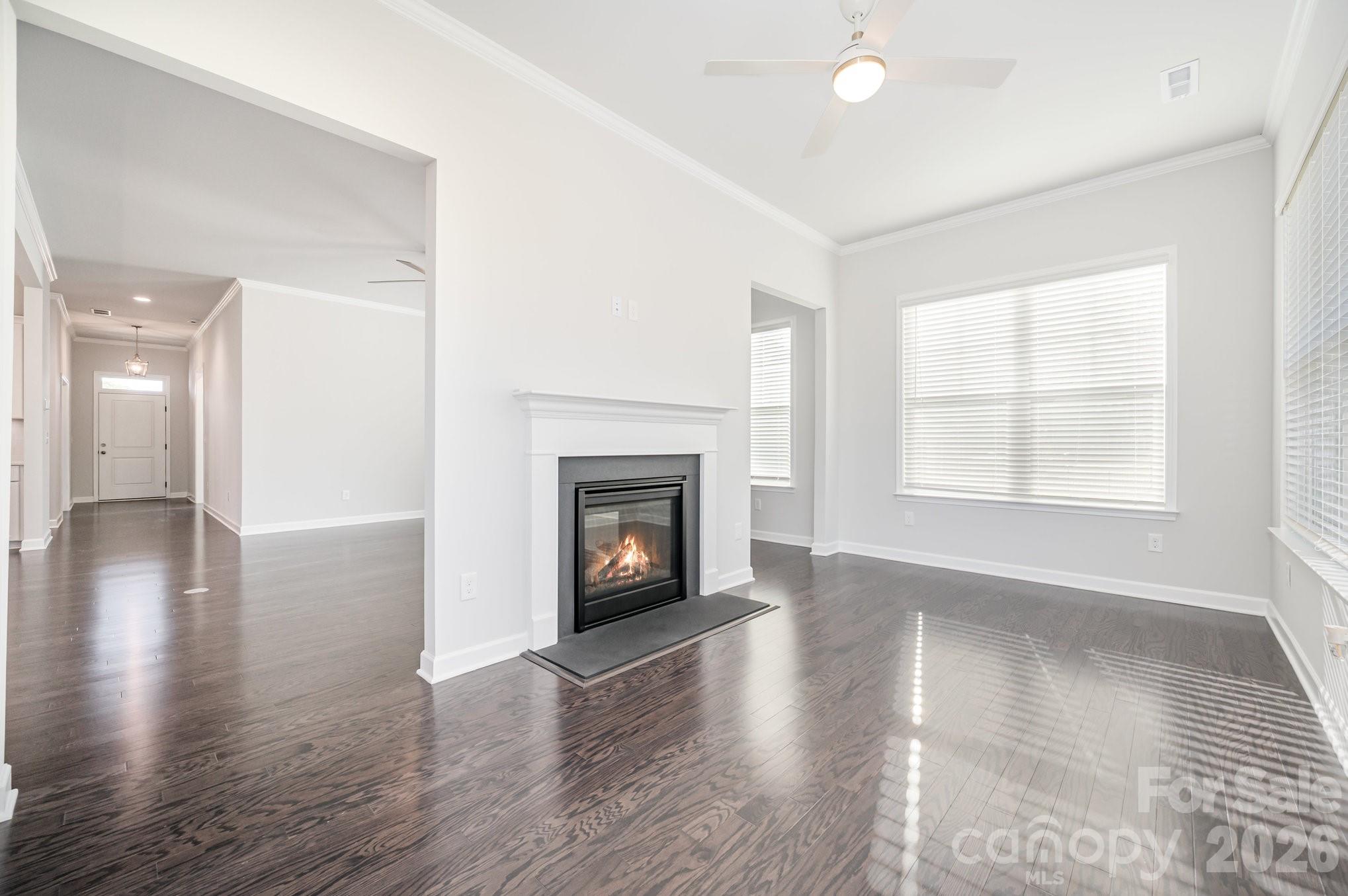 Amazing sunroom featuring a see-through, two-sided gas fireplace. - 456 Lucky Drive NW, Concord