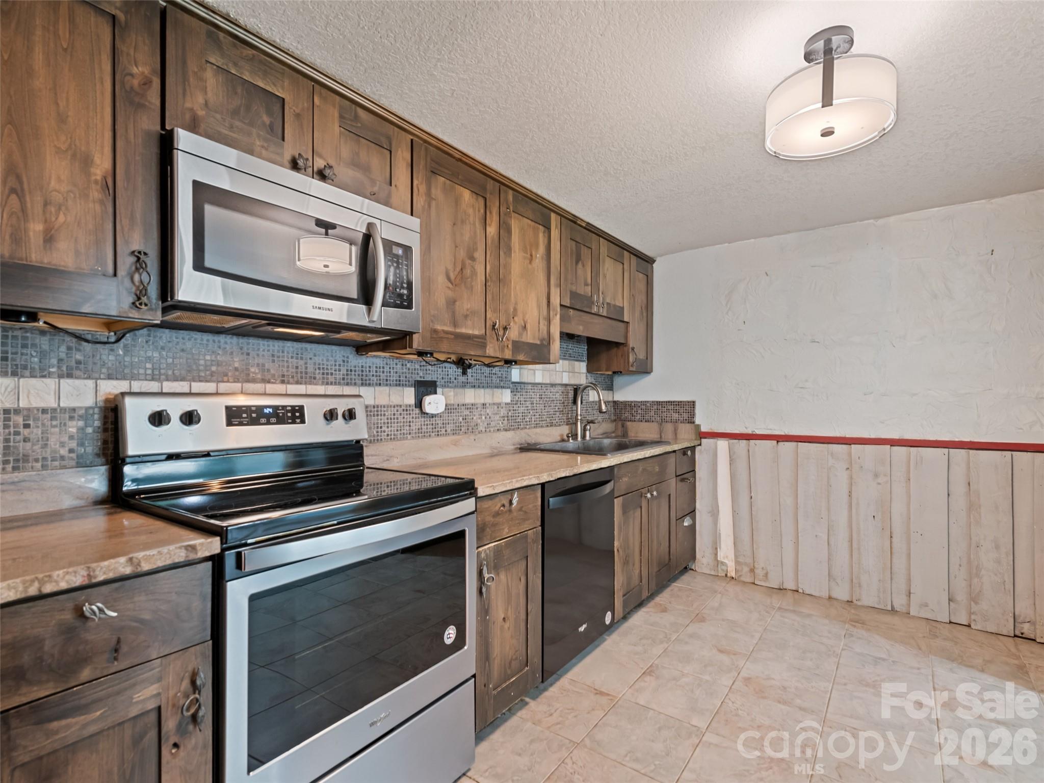Kitchen was remodeled in 2023 and features granite countertops and a soapstone sink - 838 Hidden Valley Road, Clyde