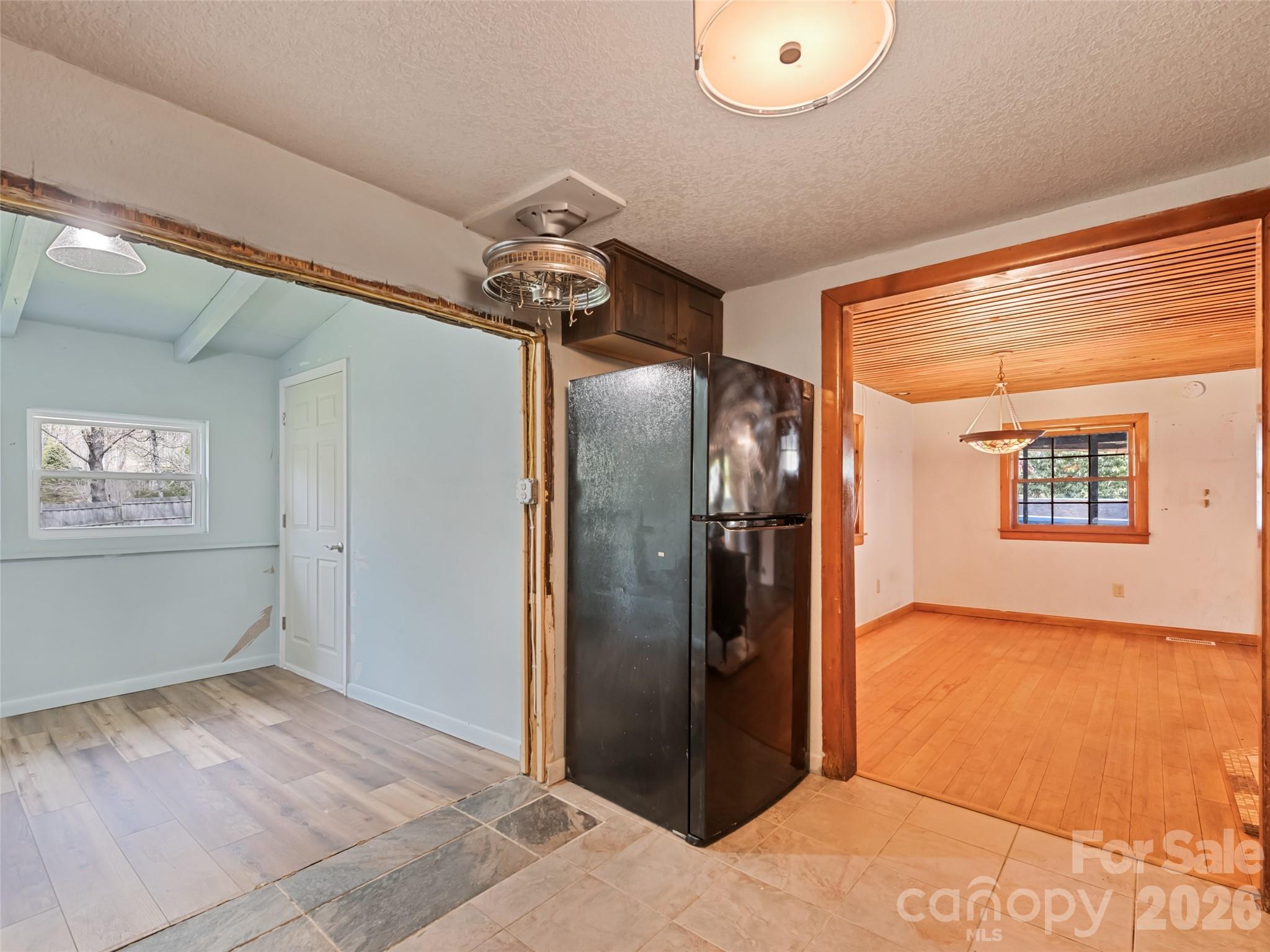 Open flow from living to kitchen to primary suite - 838 Hidden Valley Road, Clyde