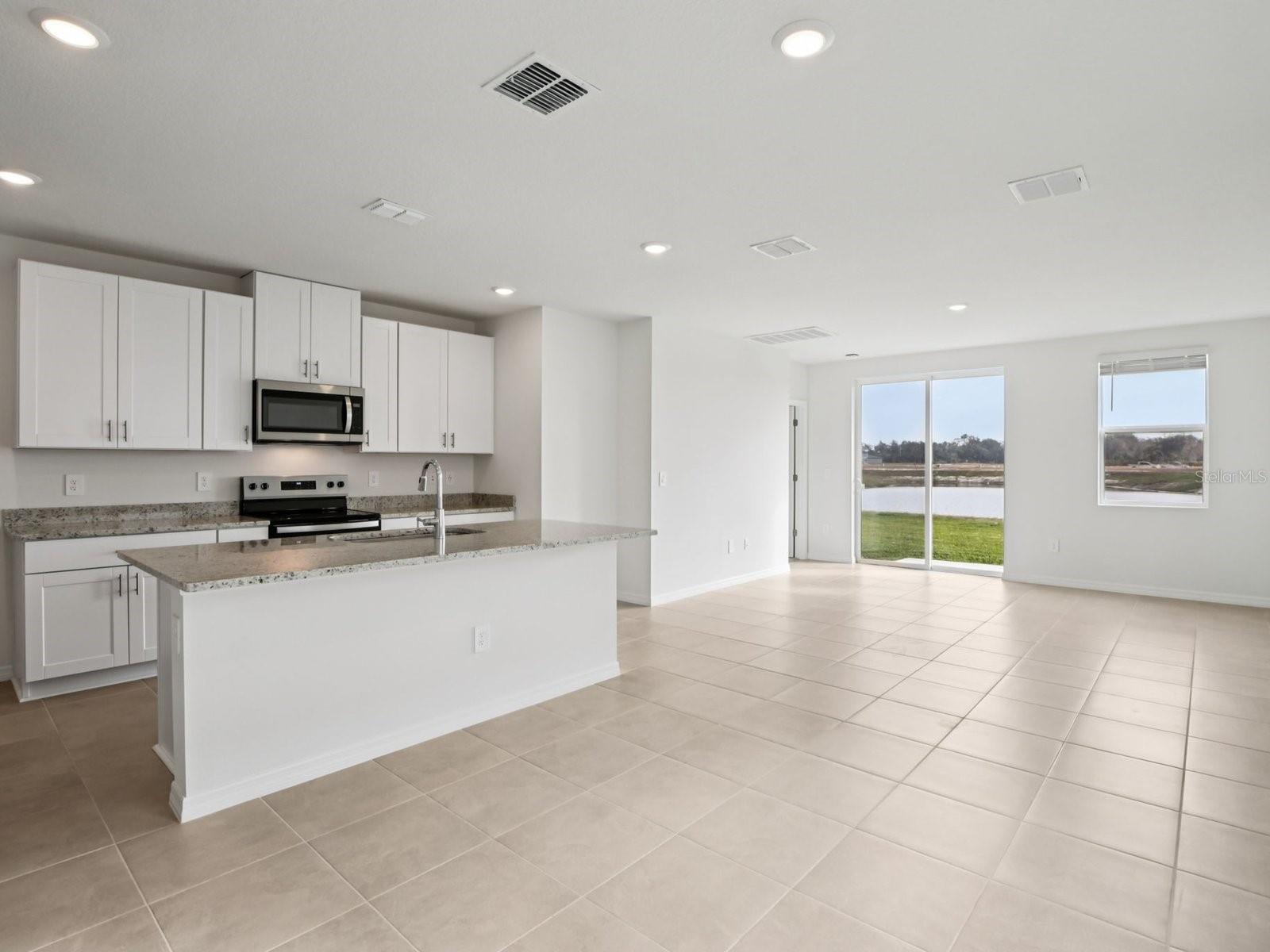 Interior photos are not of the actual home but are photos of the builder home with the same floorplan with similar interior finishes and features. - 11329 BELLEWOOD TER, PARRISH