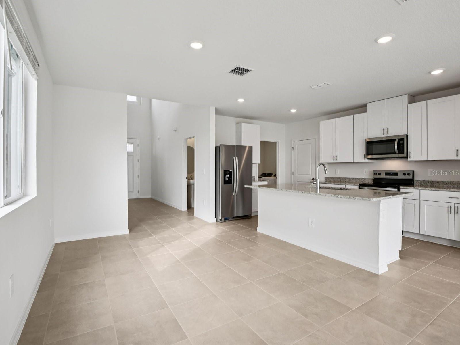 Interior photos are not of the actual home but are photos of the builder home with the same floorplan with similar interior finishes and features. - 11329 BELLEWOOD TER, PARRISH