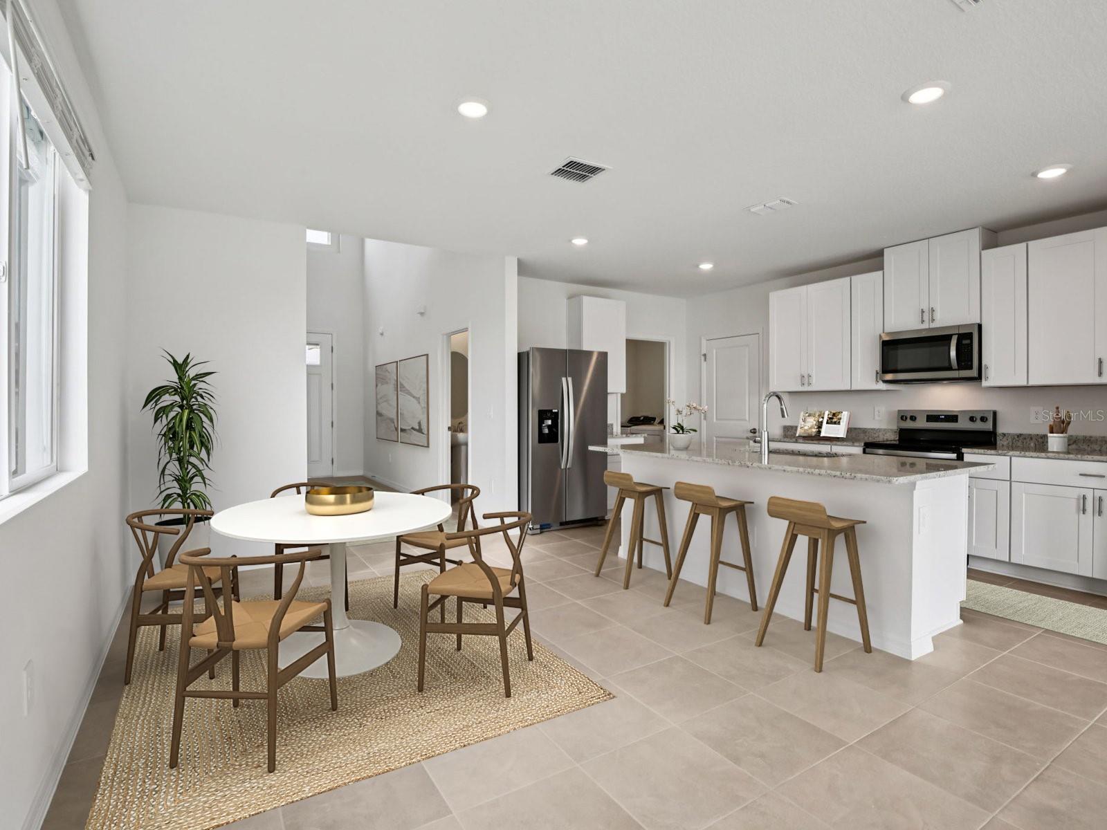 Interior photos are not of the actual home but are photos of the builder home with same floorplan with similar interior finishes and features. Photo uses virtual staging. - 11329 BELLEWOOD TER, PARRISH