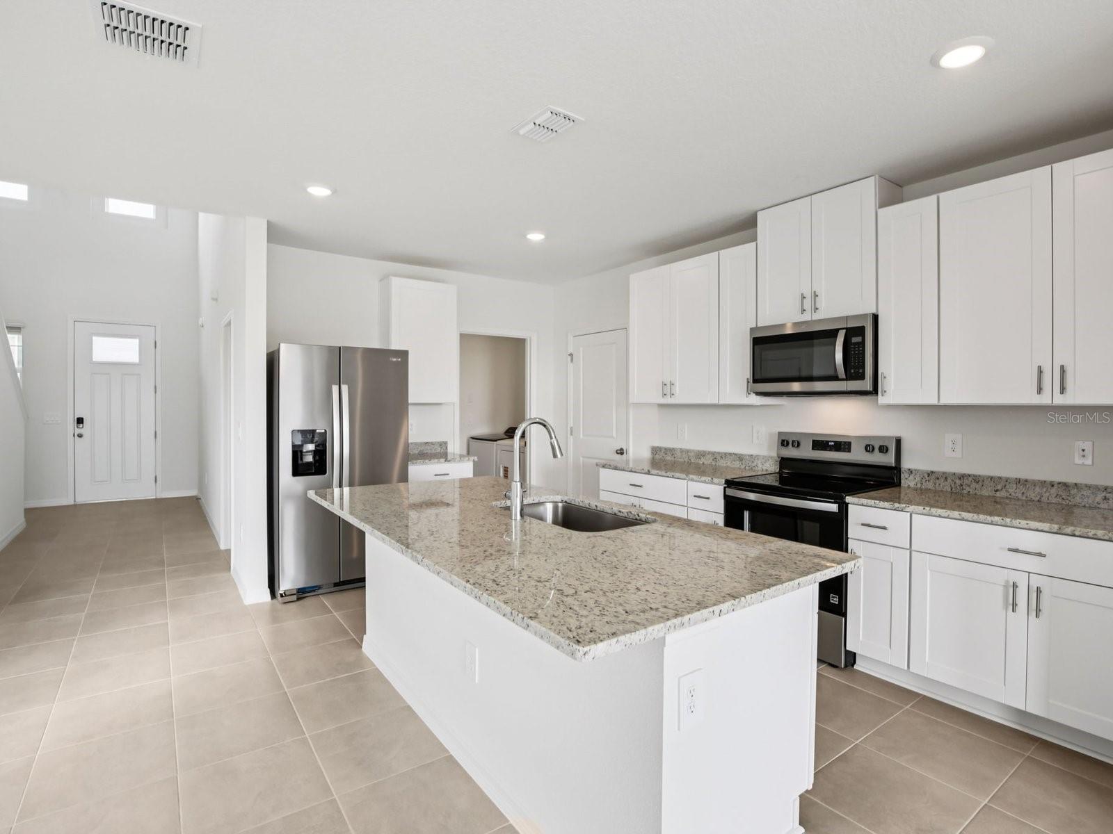 Interior photos are not of the actual home but are photos of the builder home with the same floorplan with similar interior finishes and features. - 11329 BELLEWOOD TER, PARRISH