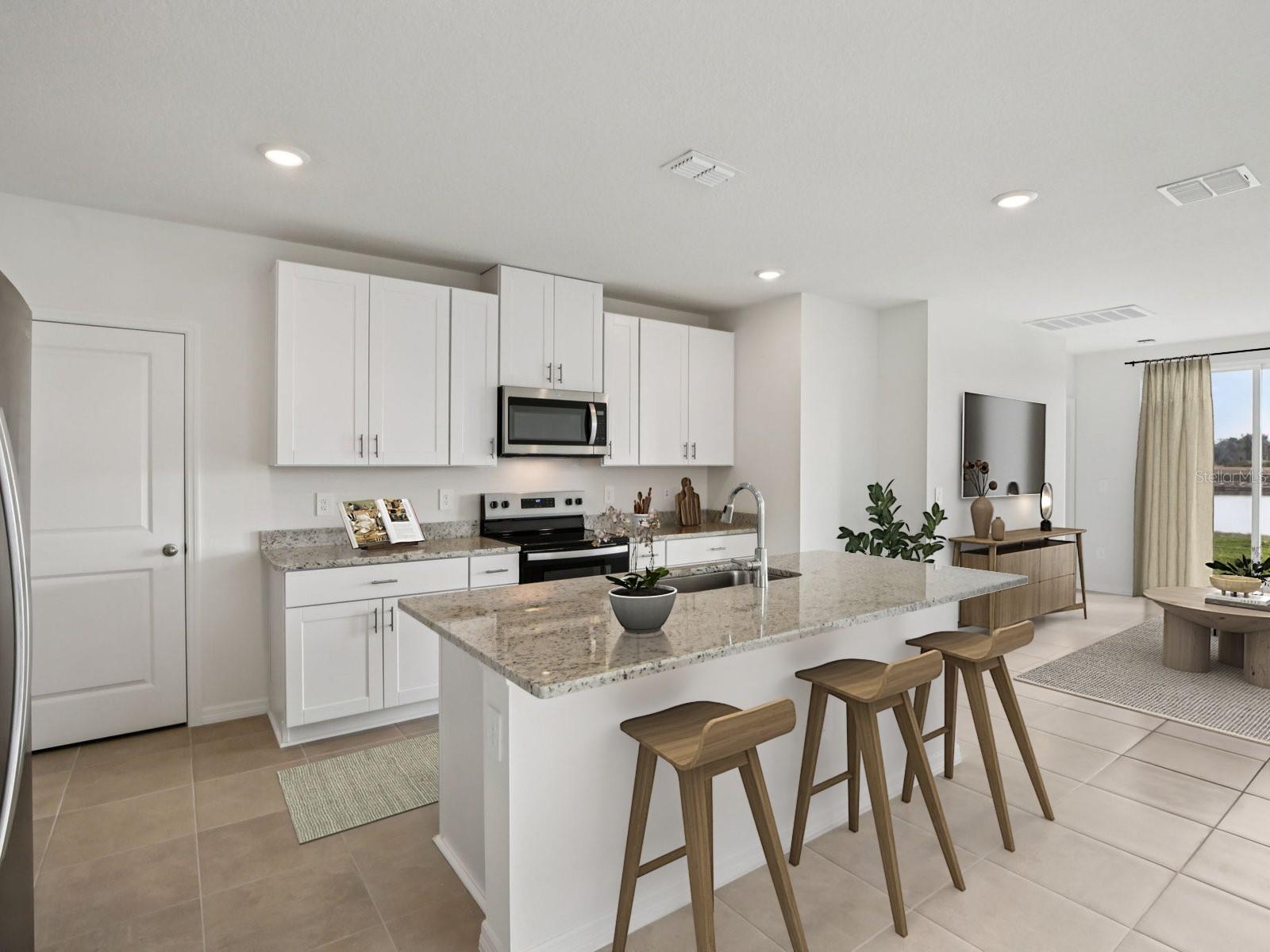 Interior photos are not of the actual home but are photos of the builder home with same floorplan with similar interior finishes and features. Photo uses virtual staging. - 11329 BELLEWOOD TER, PARRISH