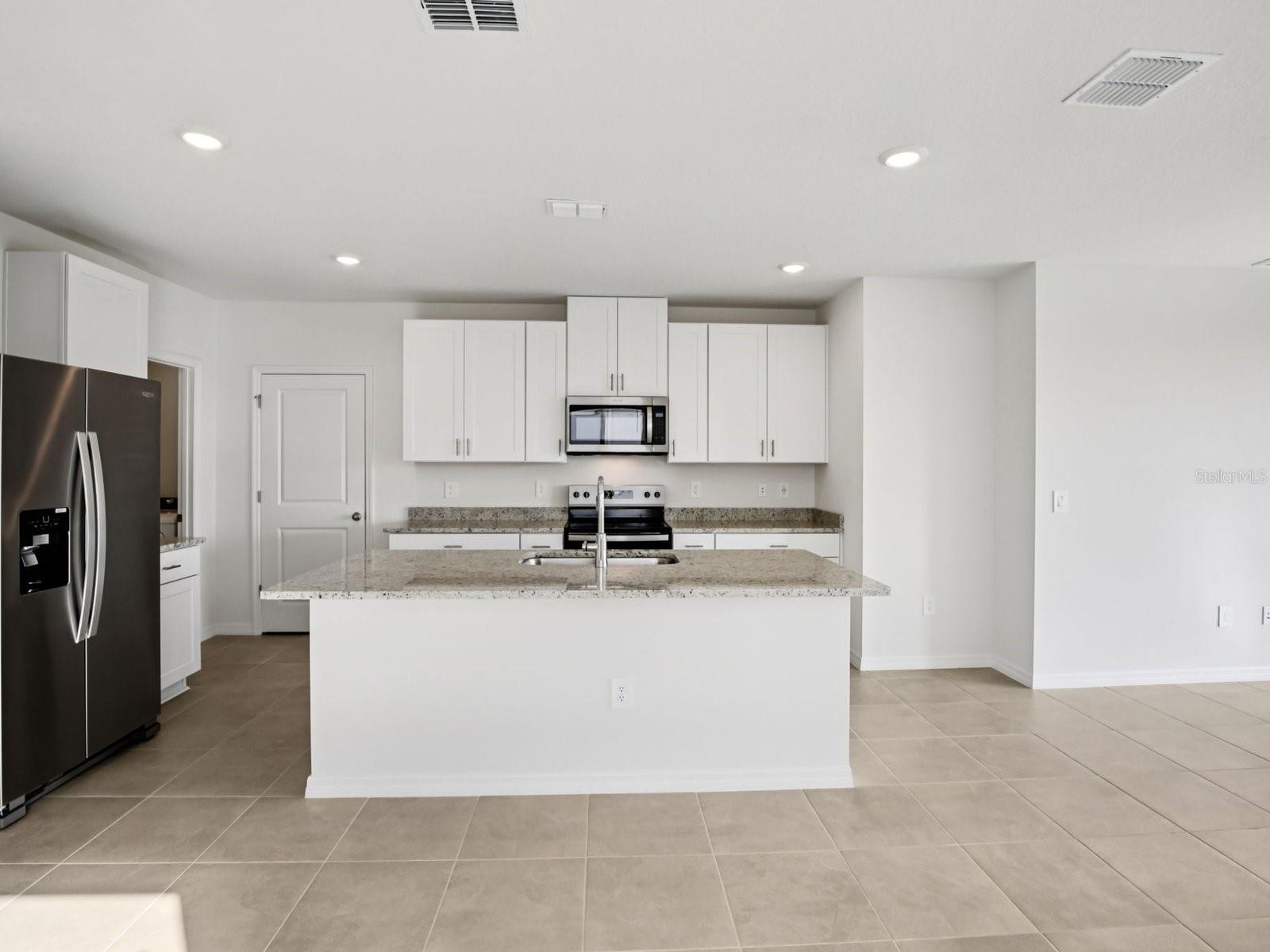 Interior photos are not of the actual home but are photos of the builder home with the same floorplan with similar interior finishes and features. - 11329 BELLEWOOD TER, PARRISH