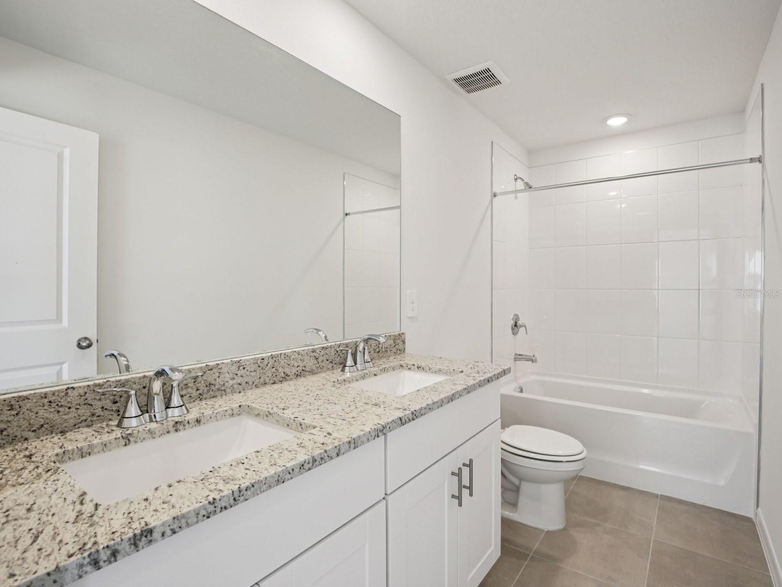 Interior photos are not of the actual home but are photos of the builder home with the same floorplan with similar interior finishes and features. - 11329 BELLEWOOD TER, PARRISH