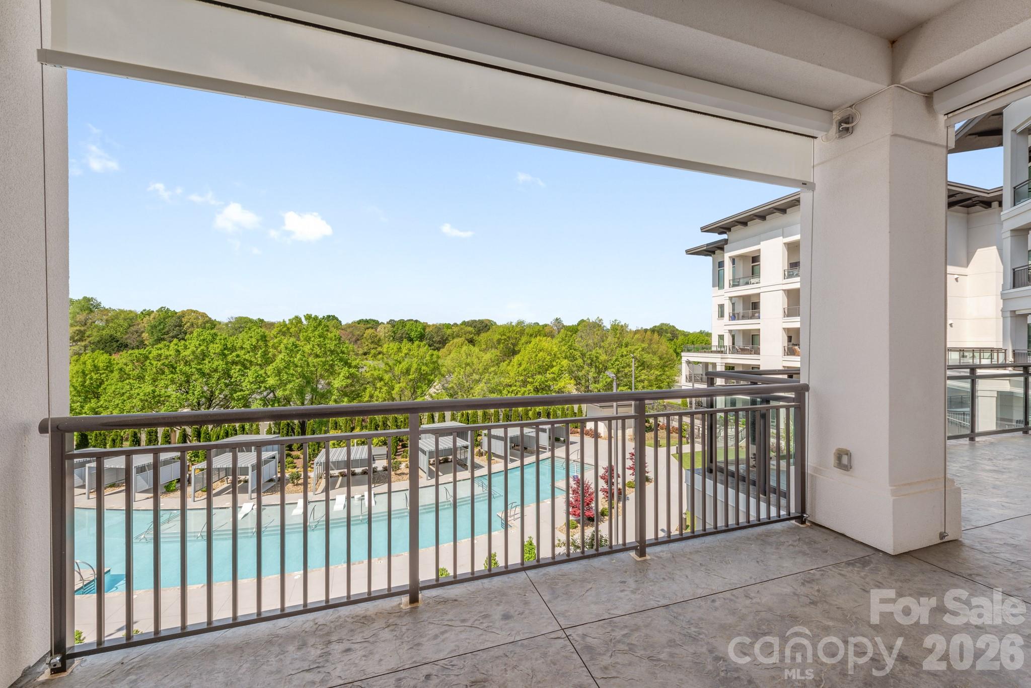 Covered lanai view with electronic shades for privacy - 19329 Watermark Drive, Cornelius